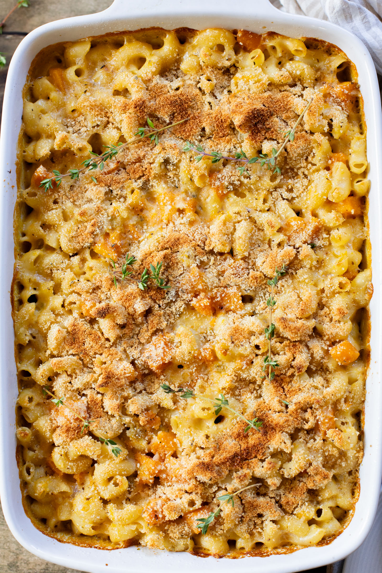 This Cheesy Butternut Squash Pasta Bake is the perfect vegan holiday casserole! Made with a dairy-free cheese sauce & tender squash pieces | ThisSavoryVegan.com