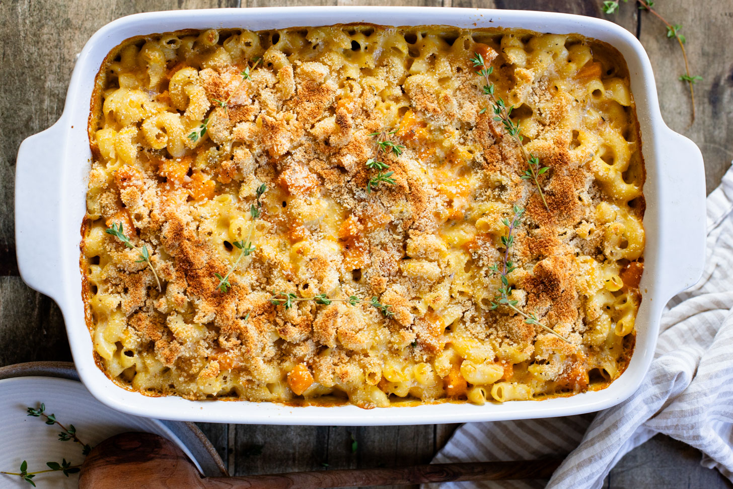 This Cheesy Butternut Squash Pasta Bake is the perfect vegan holiday casserole! Made with a dairy-free cheese sauce & tender squash pieces | ThisSavoryVegan.com