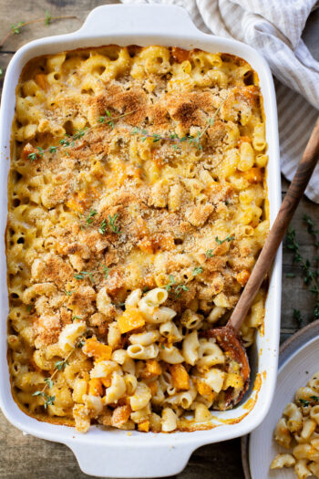 This Cheesy Butternut Squash Pasta Bake is the perfect vegan holiday casserole! Made with a dairy-free cheese sauce & tender squash pieces | ThisSavoryVegan.com
