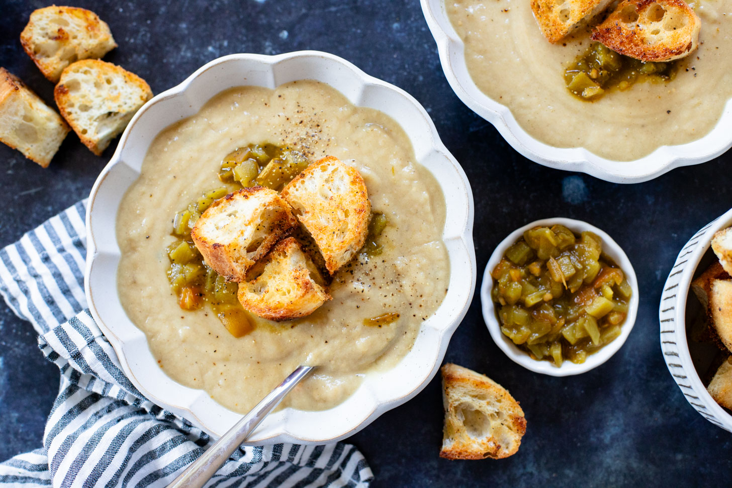 This Salsa Verde Cauliflower Soup is creamy & delicious. The salsa verde adds an unexpected and tasty flavor that takes this dairy-free soup to the next level | ThisSavoryVegan.com