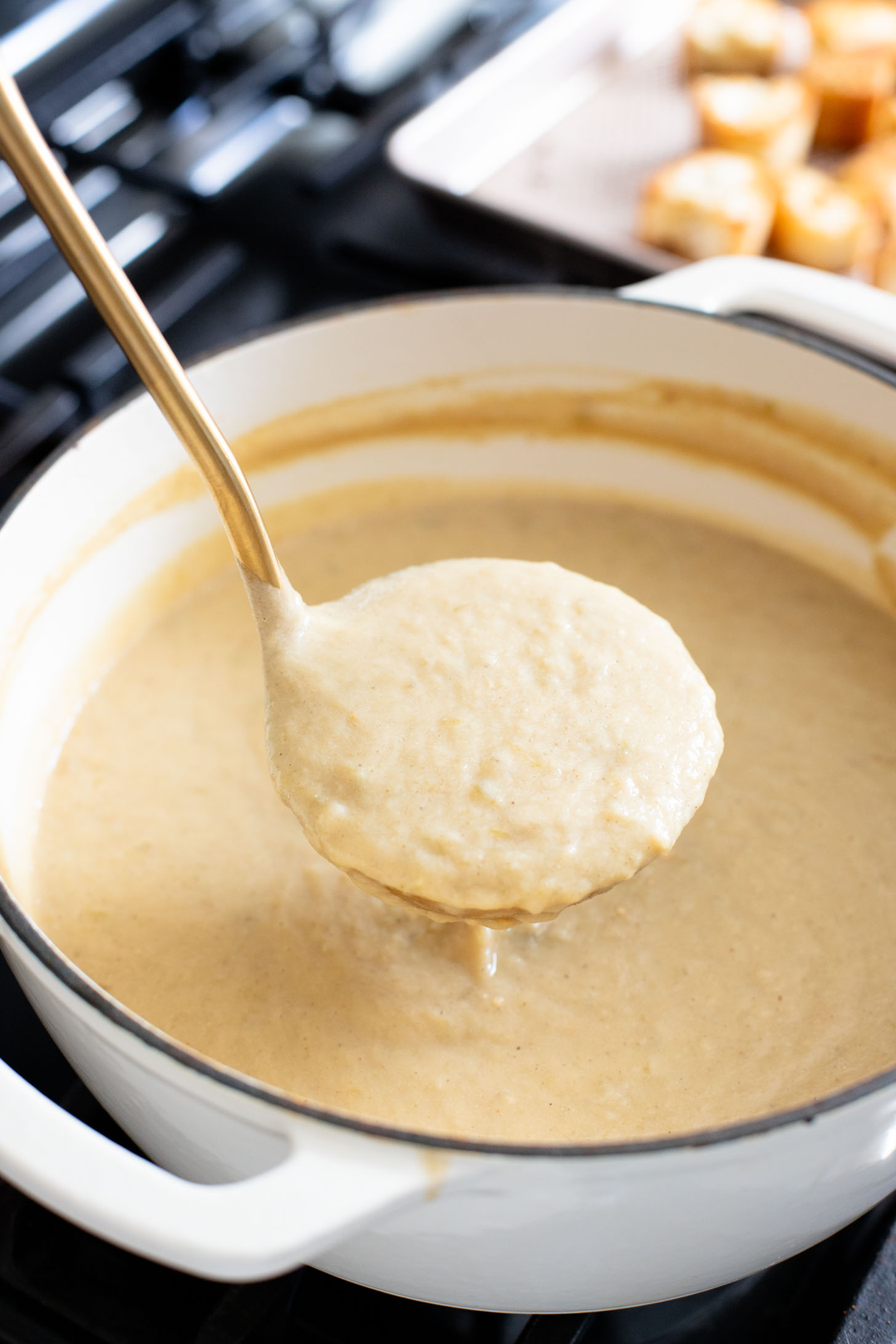 This Salsa Verde Cauliflower Soup is creamy & delicious. The salsa verde adds an unexpected and tasty flavor that takes this dairy-free soup to the next level | ThisSavoryVegan.com