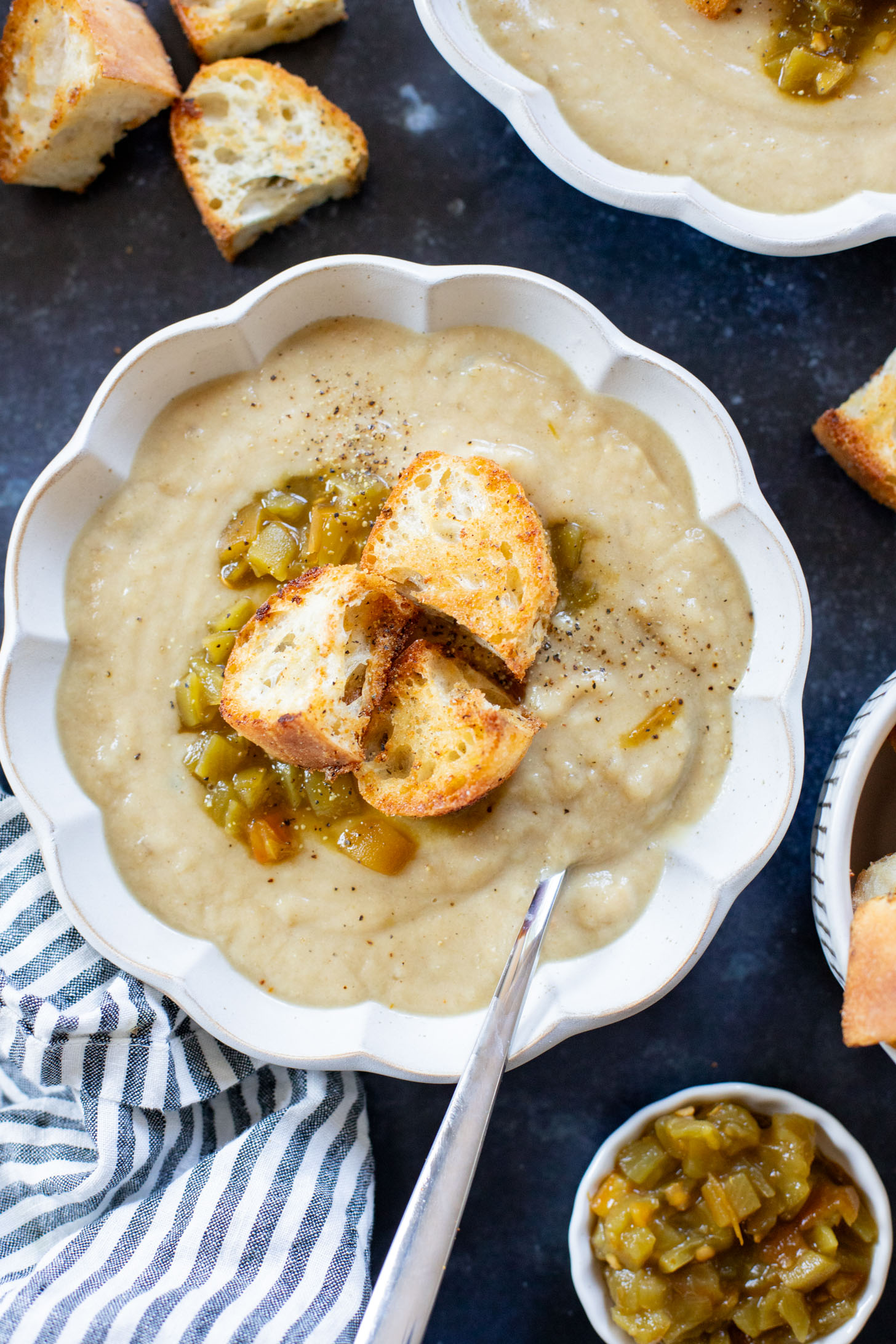 This Salsa Verde Cauliflower Soup is creamy & delicious. The salsa verde adds an unexpected and tasty flavor that takes this dairy-free soup to the next level | ThisSavoryVegan.com