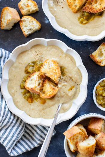 This Salsa Verde Cauliflower Soup is creamy & delicious. The salsa verde adds an unexpected and tasty flavor that takes this dairy-free soup to the next level | ThisSavoryVegan.com