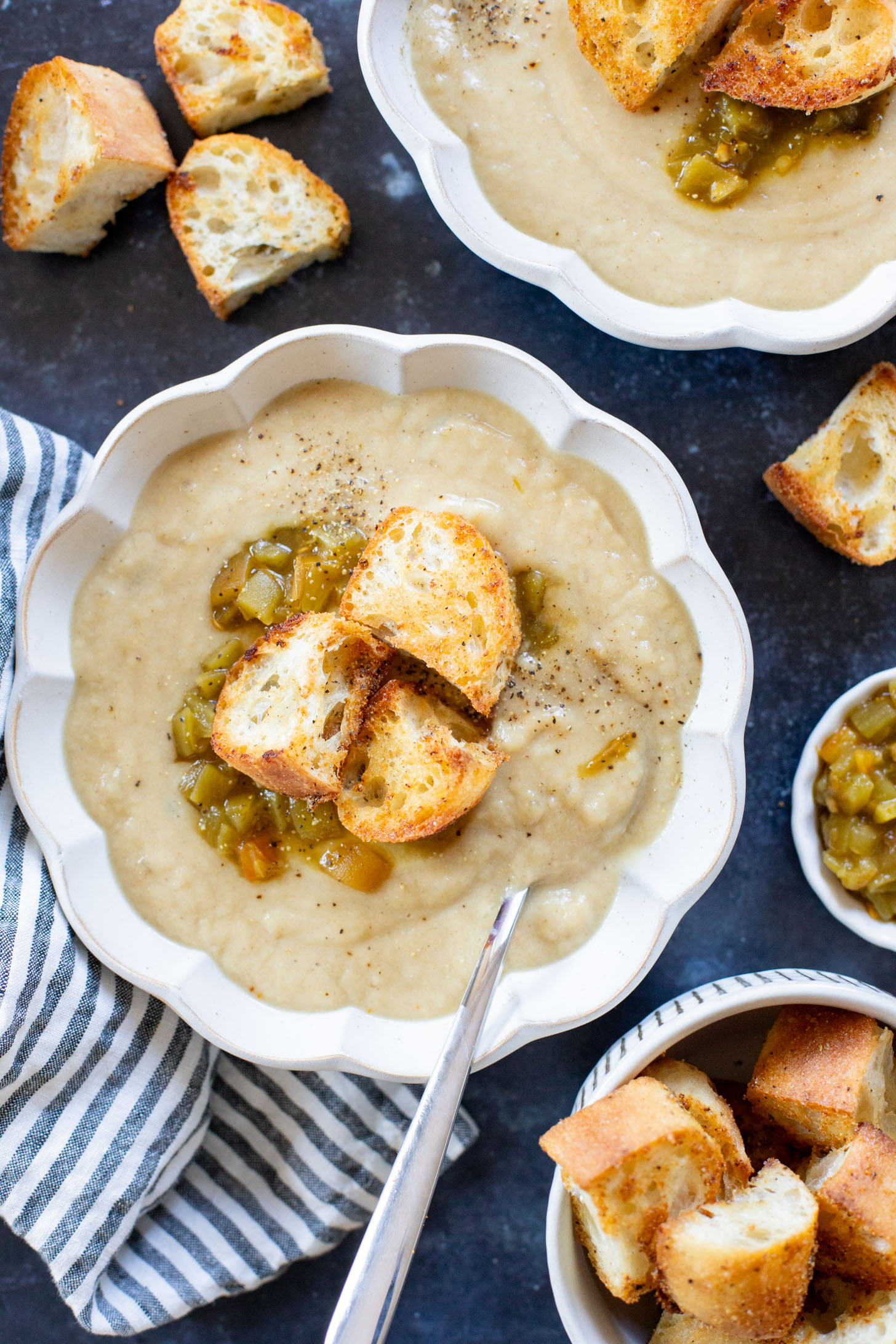 This Salsa Verde Cauliflower Soup is creamy & delicious. The salsa verde adds an unexpected and tasty flavor that takes this dairy-free soup to the next level | ThisSavoryVegan.com