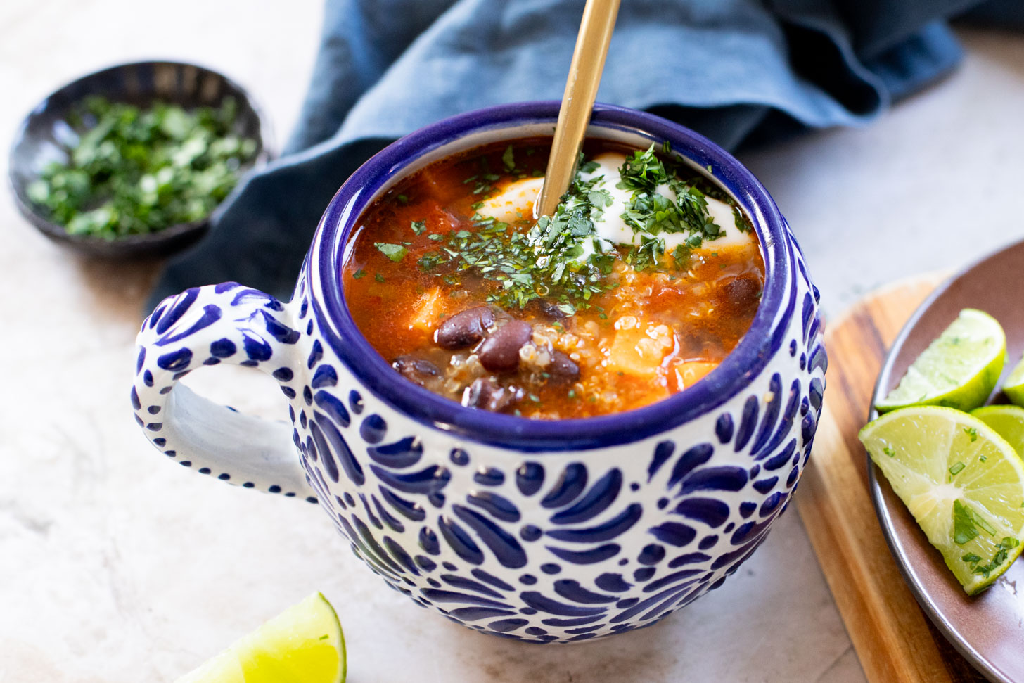Healthy & delicious, this Sweet Potato Black Bean Soup is loaded with veggies, black beans and quinoa. Made in one pot in under an hour | ThisSavoryVegan.com