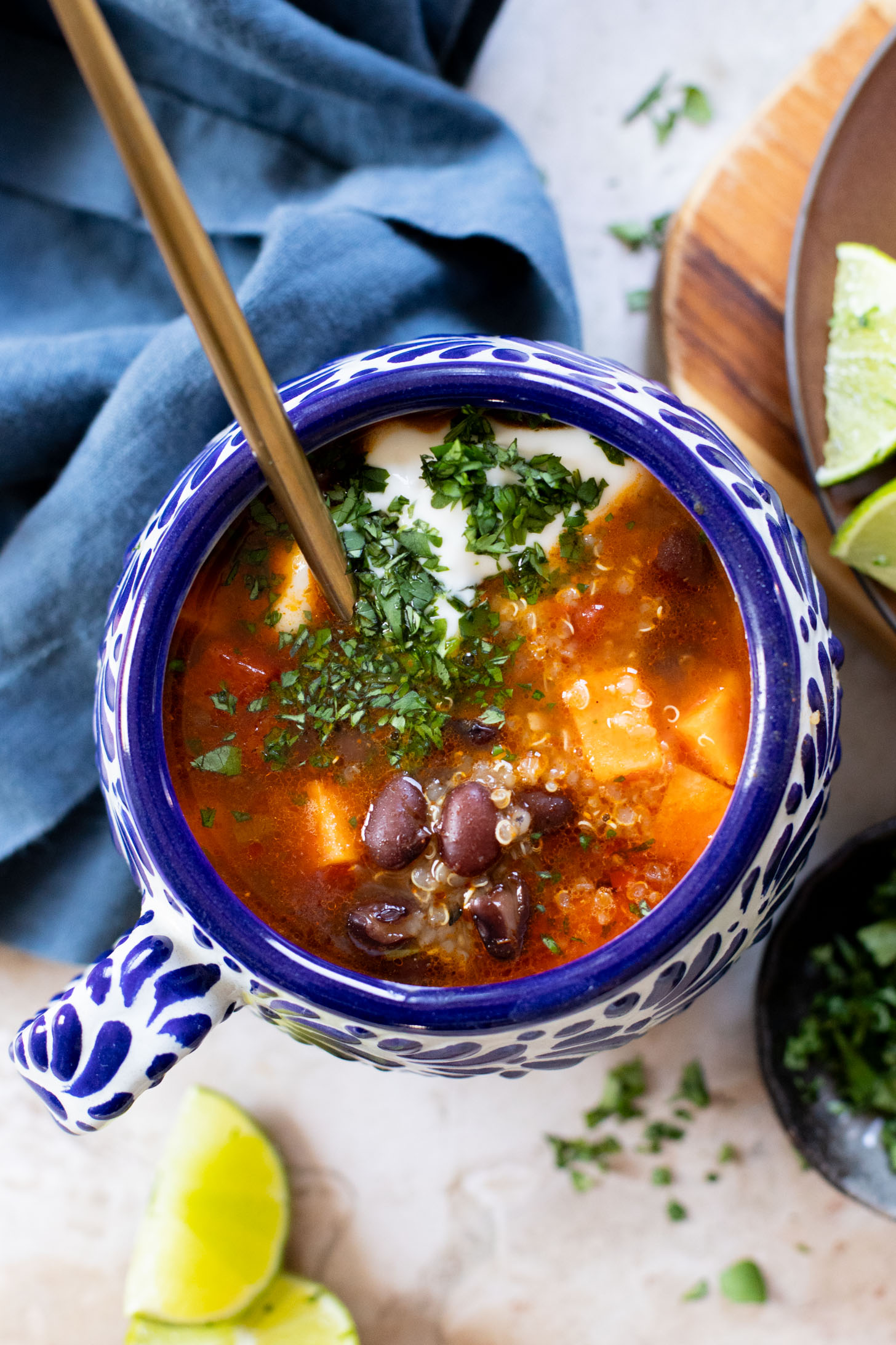 Healthy & delicious, this Sweet Potato Black Bean Soup is loaded with veggies, black beans and quinoa. Made in one pot in under an hour | ThisSavoryVegan.com