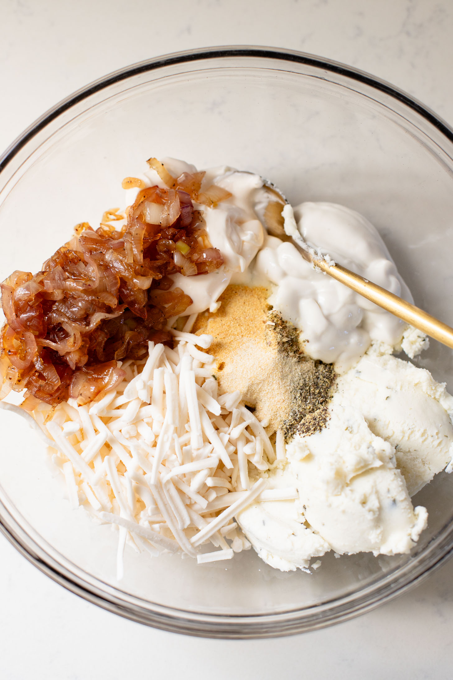 If you want to impress a crowd, bring this Vegan Caramelized Shallot Cheese Dip to your next party! It is the perfect vegan appetizer | ThisSavoryVegan.com