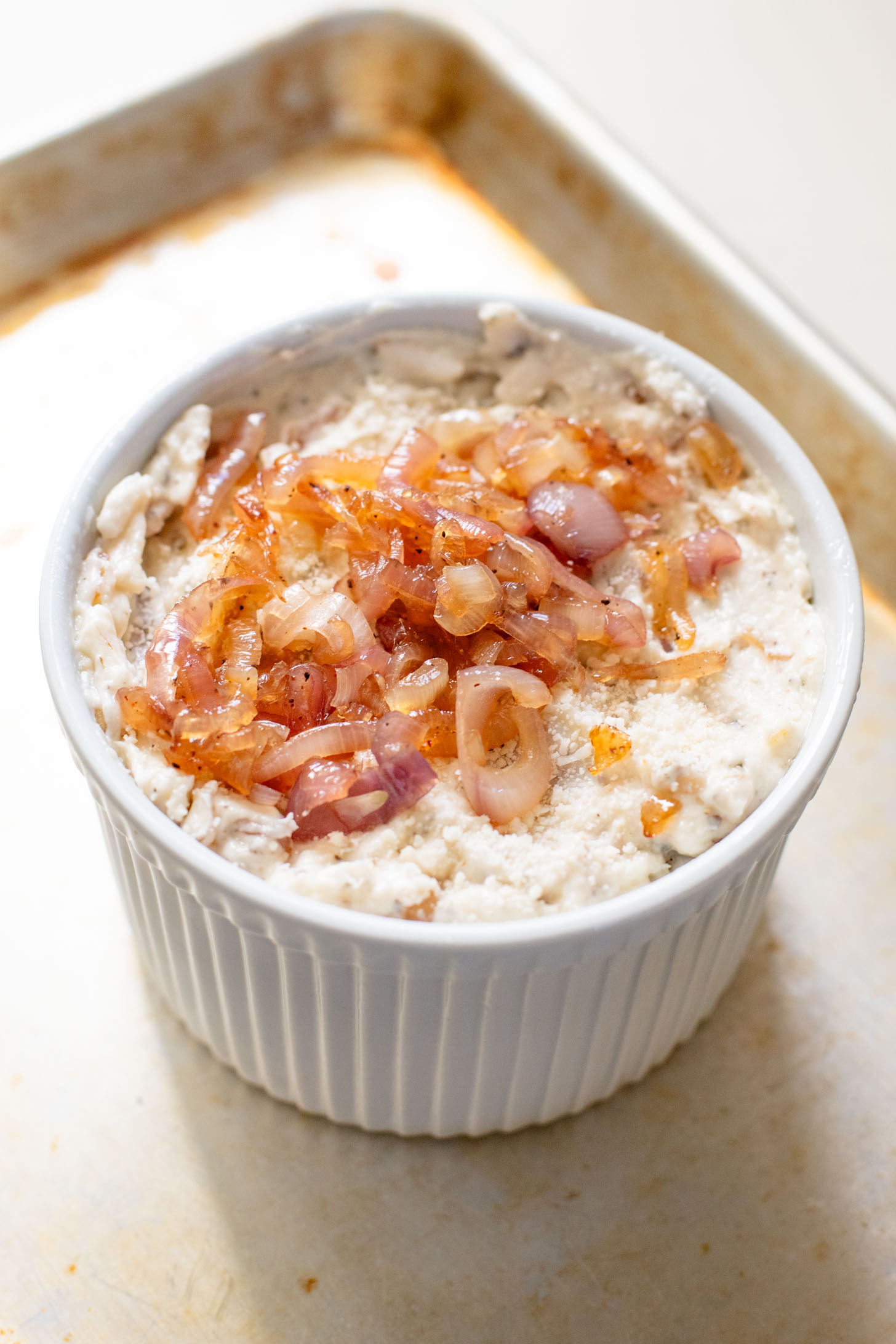 If you want to impress a crowd, bring this Vegan Caramelized Shallot Cheese Dip to your next party! It is the perfect vegan appetizer | ThisSavoryVegan.com