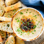 If you want to impress a crowd, bring this Vegan Caramelized Shallot Cheese Dip to your next party! It is the perfect vegan appetizer | ThisSavoryVegan.com