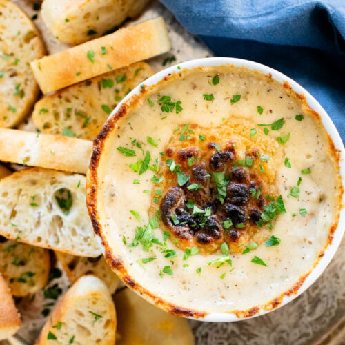 If you want to impress a crowd, bring this Vegan Caramelized Shallot Cheese Dip to your next party! It is the perfect vegan appetizer | ThisSavoryVegan.com