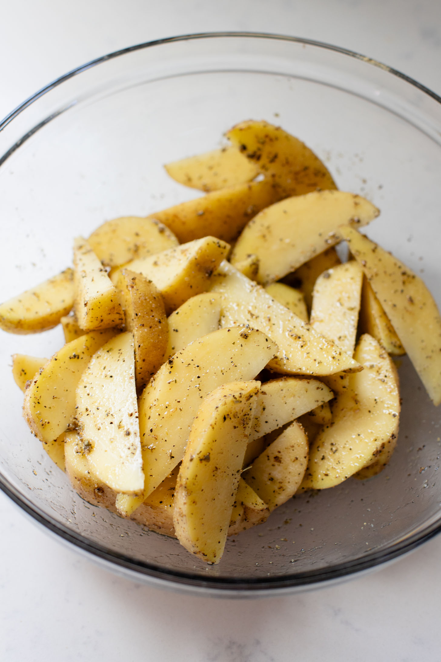 These Vegan Parmesan Crusted Potato Wedges are the most satisfying way to eat potatoes. Perfectly crispy and garlicky | ThisSavoryVegan.com