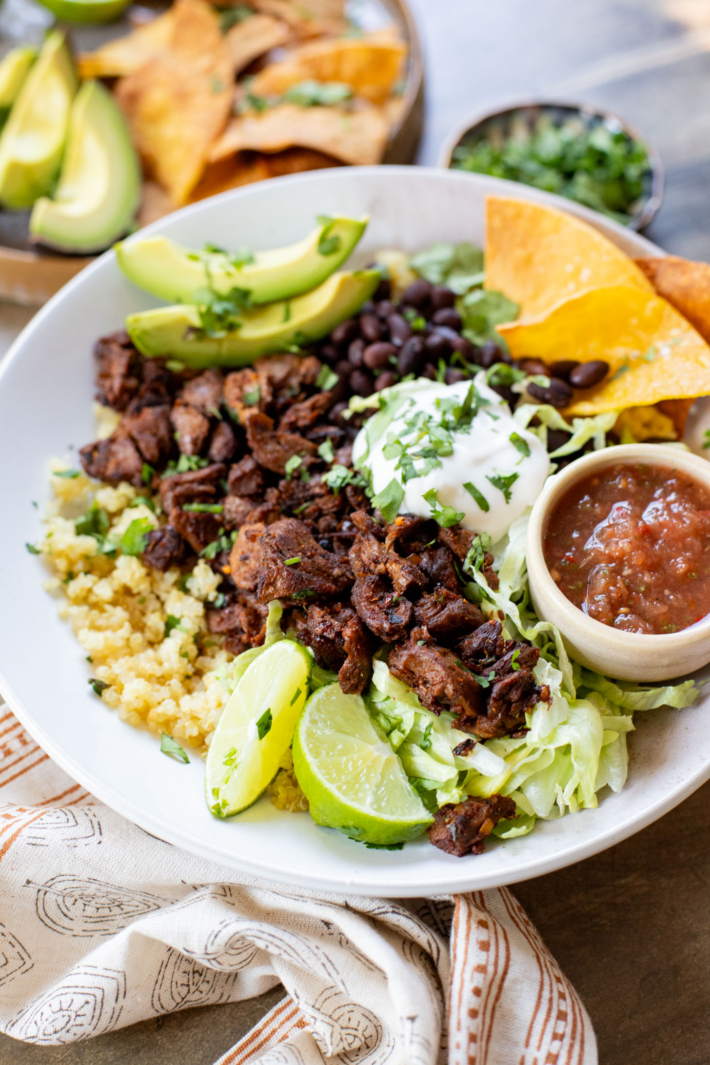 These Vegan Steak Burrito Bowls are the perfect weeknight dinner. Loaded with quinoa, vegan steak, beans and avocado - 32 grams of protein in each bowl | ThisSavoryVegan.com