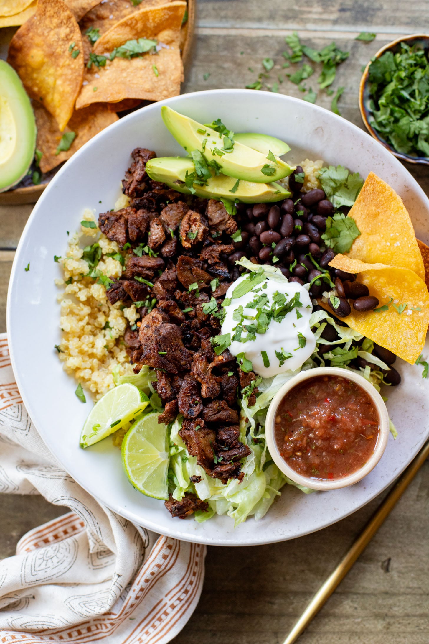 These Vegan Steak Burrito Bowls are the perfect weeknight dinner. Loaded with quinoa, vegan steak, beans and avocado - 32 grams of protein in each bowl | ThisSavoryVegan.com