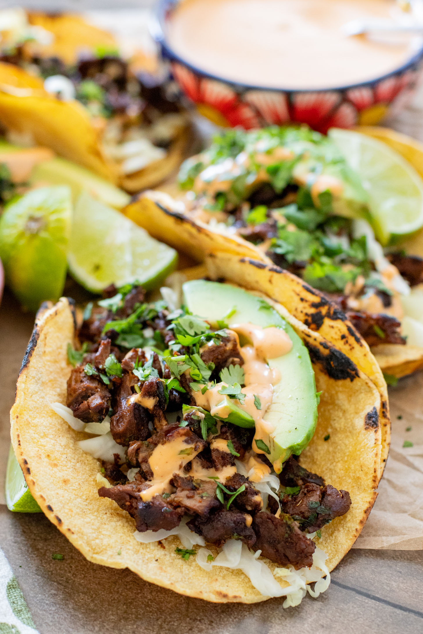These Vegan Steak Tacos are SO good! Crispy vegan steak is cooked until super crispy and then loaded up in tortillas with a creamy chipotle sauce | ThisSavoryVegan.com