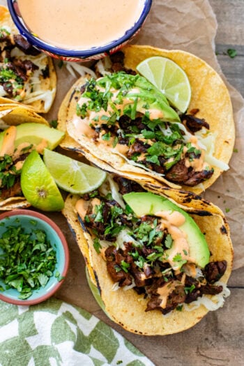These Vegan Steak Tacos are SO good! Crispy vegan steak is cooked until super crispy and then loaded up in tortillas with a creamy chipotle sauce | ThisSavoryVegan.com