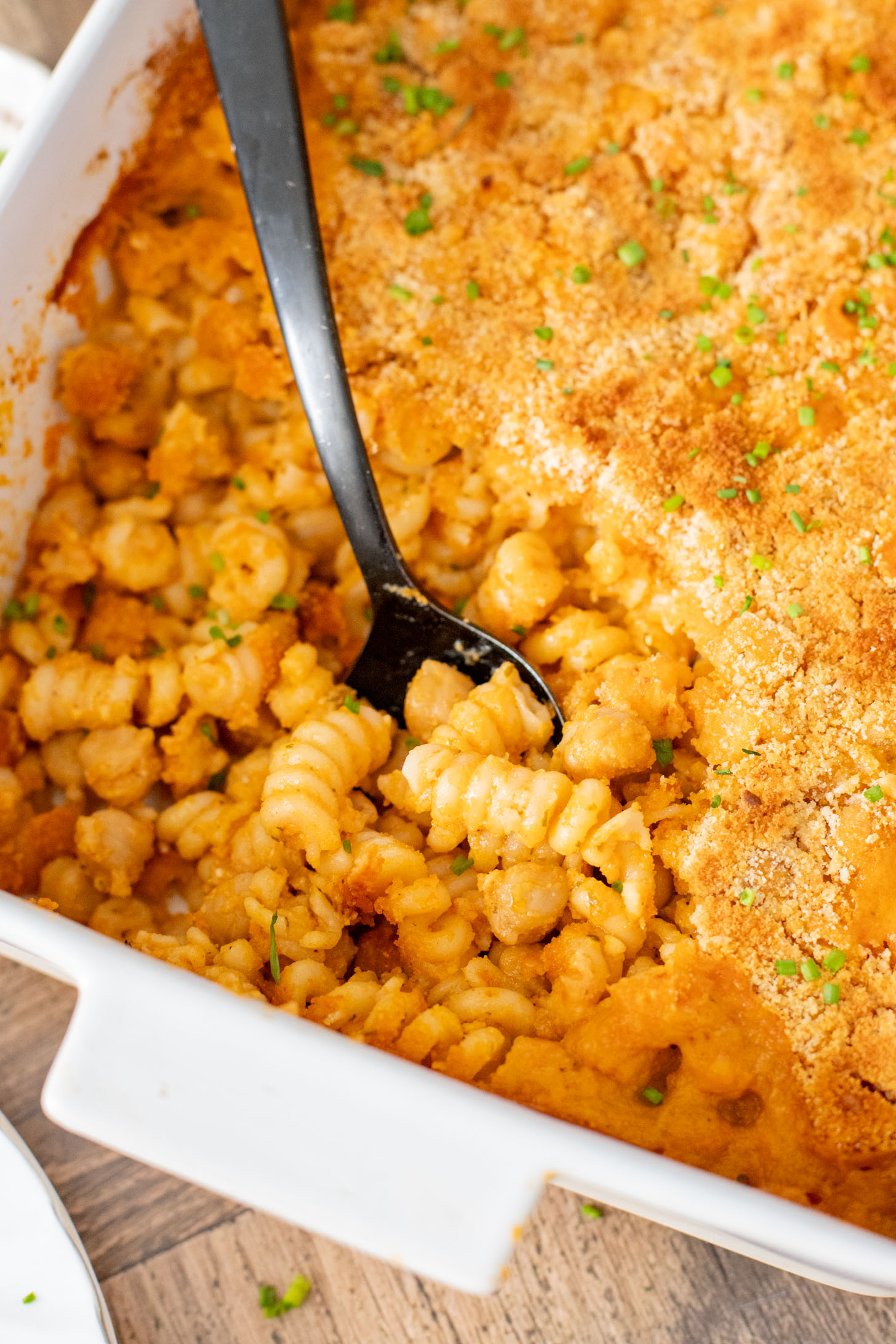Comfort food in a casserole...and it is dairy-free! This Buffalo Chickpea Pasta Bake is a super fun, family-friendly weeknight dinner idea | ThisSavoryVegan.com