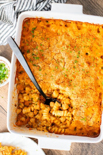 Comfort food in a casserole...and it is dairy-free! This Buffalo Chickpea Pasta Bake is a super fun, family-friendly weeknight dinner idea | ThisSavoryVegan.com