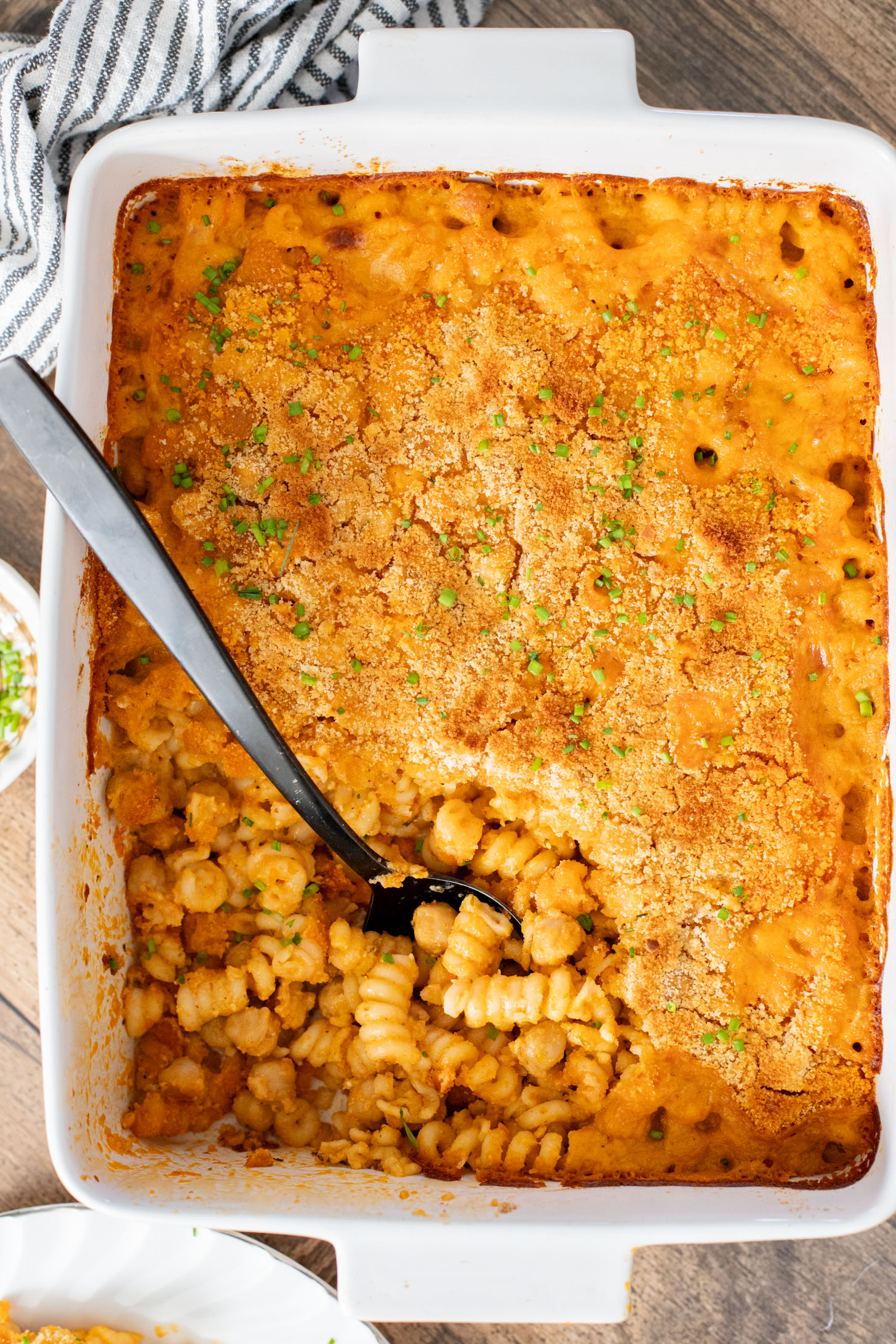 Comfort food in a casserole...and it is dairy-free! This Buffalo Chickpea Pasta Bake is a super fun, family-friendly weeknight dinner idea | ThisSavoryVegan.com