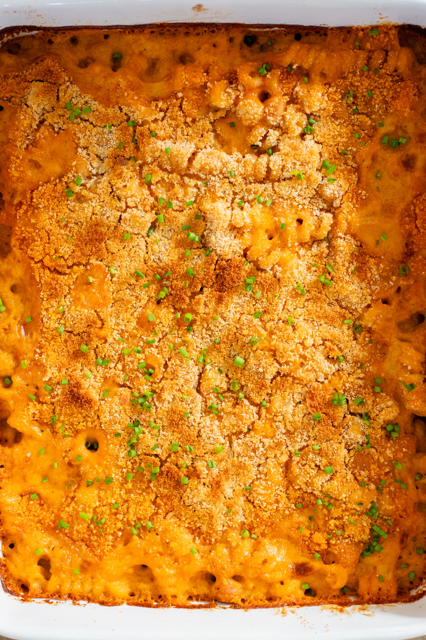 Comfort food in a casserole...and it is dairy-free! This Buffalo Chickpea Pasta Bake is a super fun, family-friendly weeknight dinner idea | ThisSavoryVegan.com