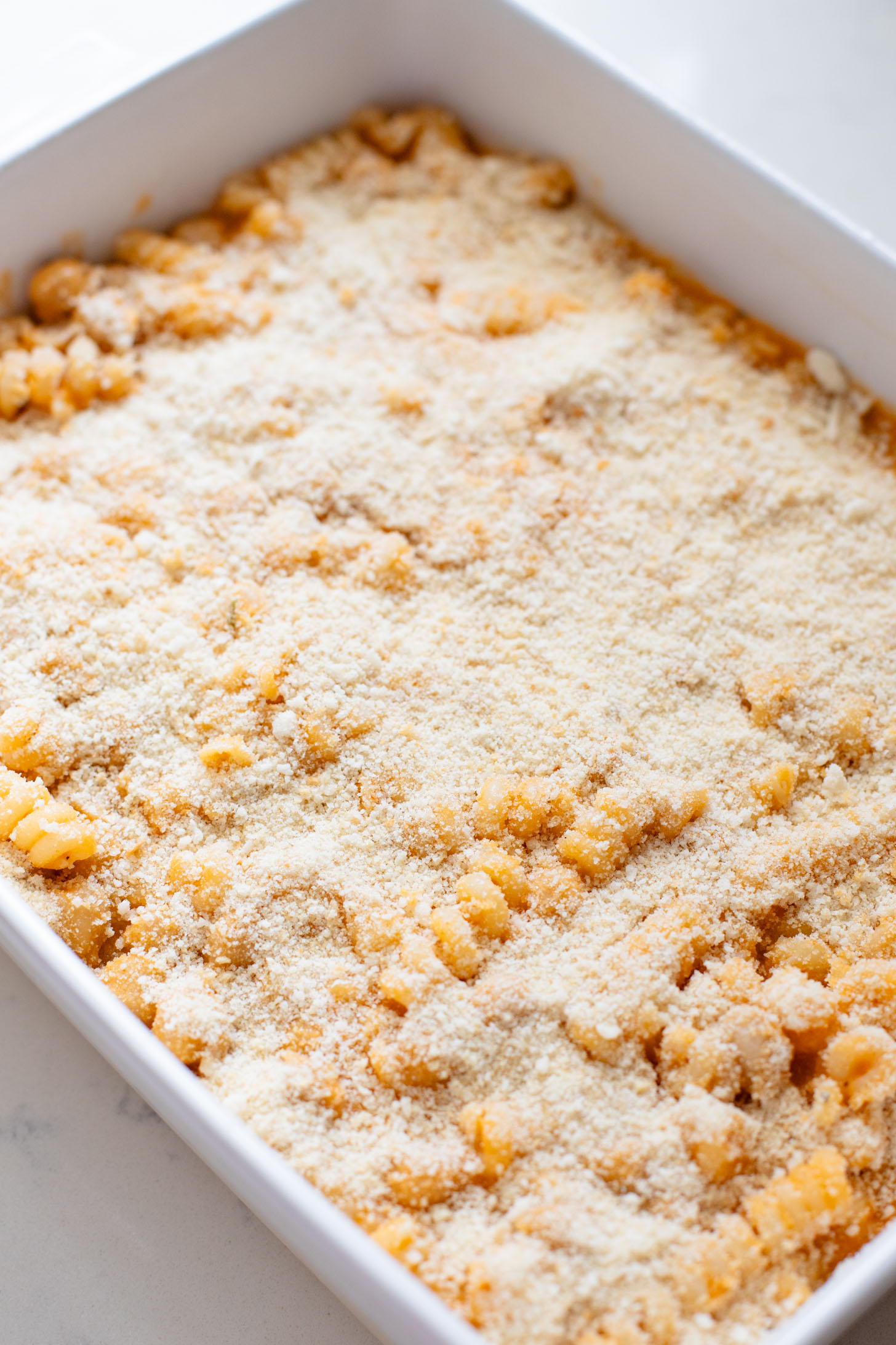 Comfort food in a casserole...and it is dairy-free! This Buffalo Chickpea Pasta Bake is a super fun, family-friendly weeknight dinner idea | ThisSavoryVegan.com