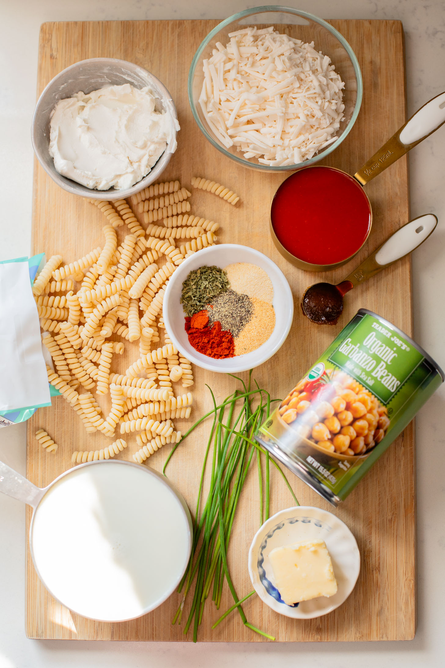 Comfort food in a casserole...and it is dairy-free! This Buffalo Chickpea Pasta Bake is a super fun, family-friendly weeknight dinner idea | ThisSavoryVegan.com