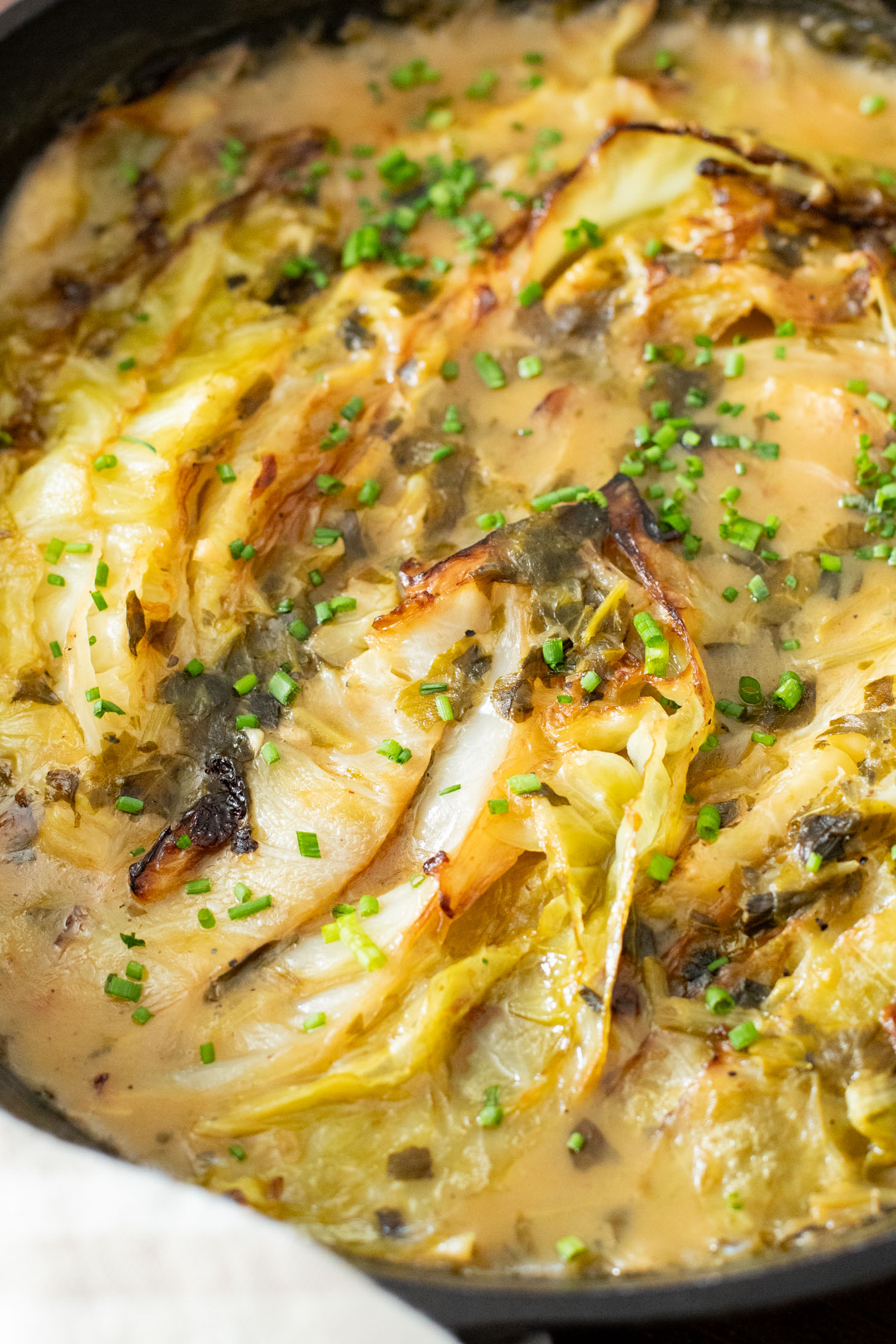 This dairy-free Charred Cabbage in Creamy Spinach Sauce is the ultimate veggie side dish! When comfort food & veggies meet | ThisSavoryVegan.com