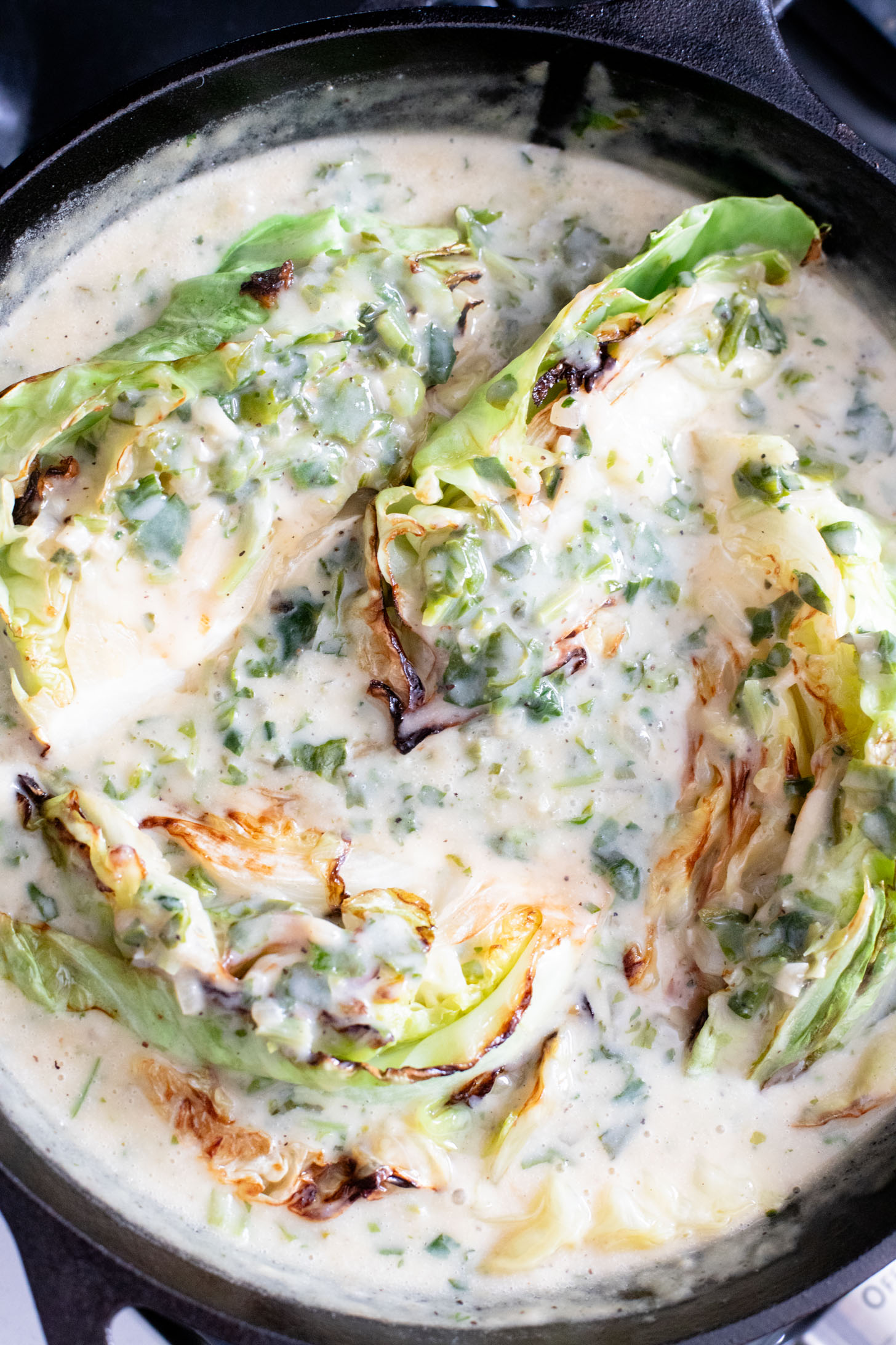 This dairy-free Charred Cabbage in Creamy Spinach Sauce is the ultimate veggie side dish! When comfort food & veggies meet | ThisSavoryVegan.com