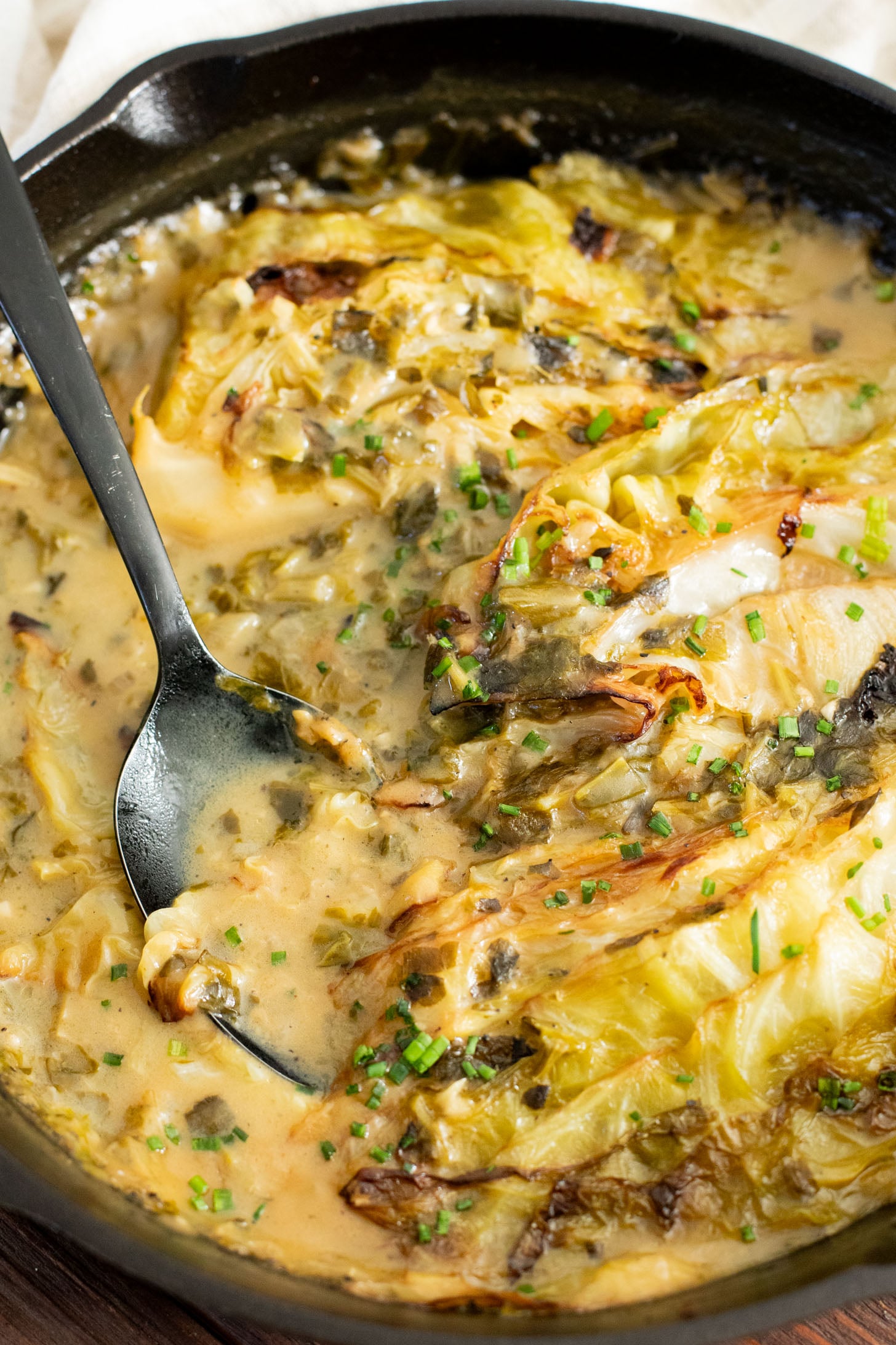 This dairy-free Charred Cabbage in Creamy Spinach Sauce is the ultimate veggie side dish! When comfort food & veggies meet | ThisSavoryVegan.com