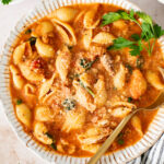 This Creamy Sausage & Pasta Soup is made with vegan sausage and dairy-free cream! A cozy vegan soup filled with veggies & pasta | ThisSavoryVegan.com