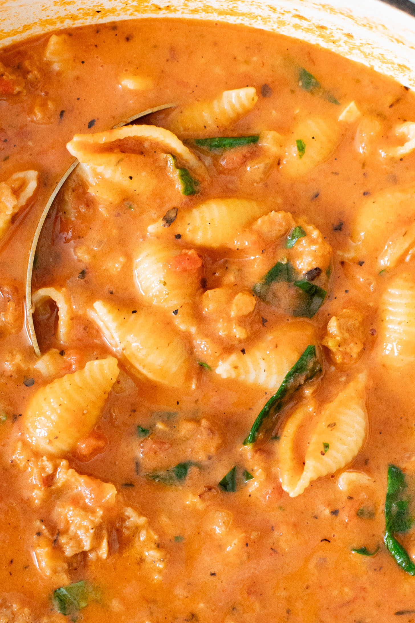 This Creamy Sausage & Pasta Soup is made with vegan sausage and dairy-free cream! A cozy vegan soup filled with veggies & pasta | ThisSavoryVegan.com