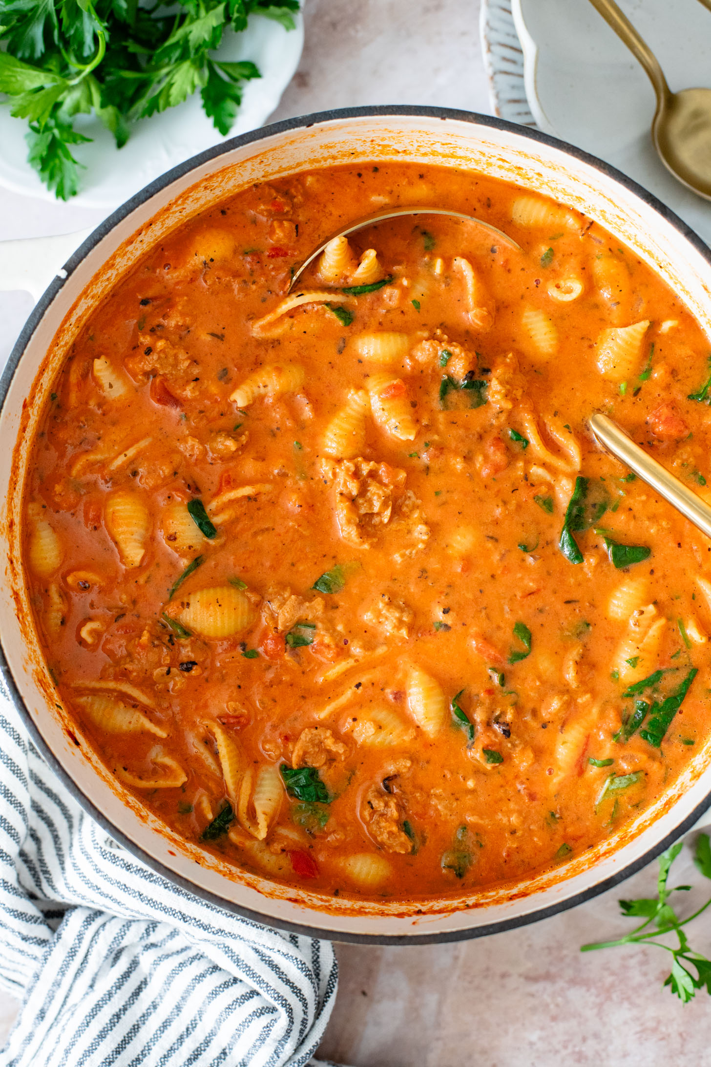 This Creamy Sausage & Pasta Soup is made with vegan sausage and dairy-free cream! A cozy vegan soup filled with veggies & pasta | ThisSavoryVegan.com
