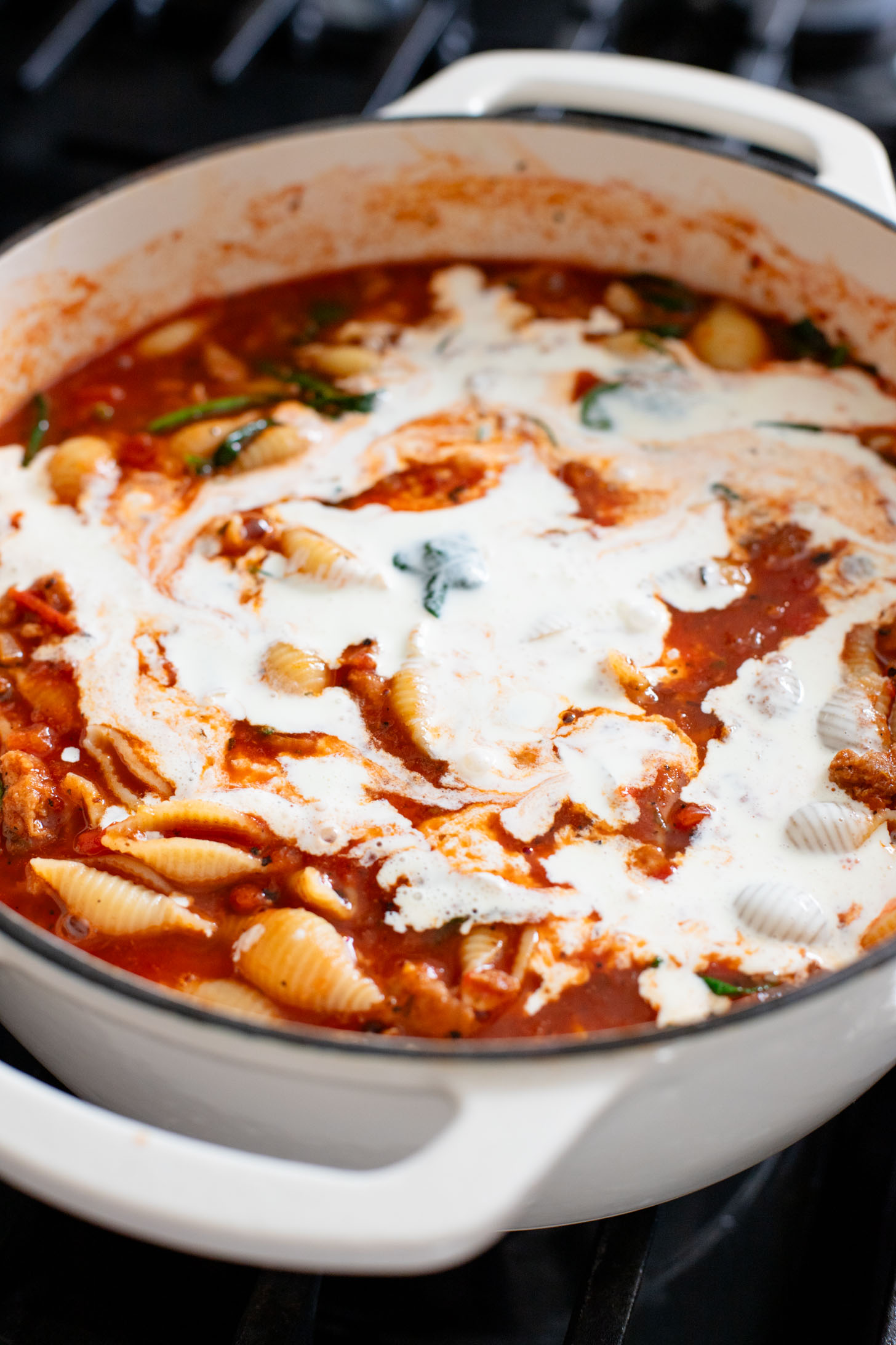 This Creamy Sausage & Pasta Soup is made with vegan sausage and dairy-free cream! A cozy vegan soup filled with veggies & pasta | ThisSavoryVegan.com