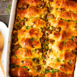 This Crescent Roll Breakfast Casserole is made with vegan eggs & vegan sausage. Perfect vegan breakfast casserole to serve a crowd | ThisSavoryVegan.com