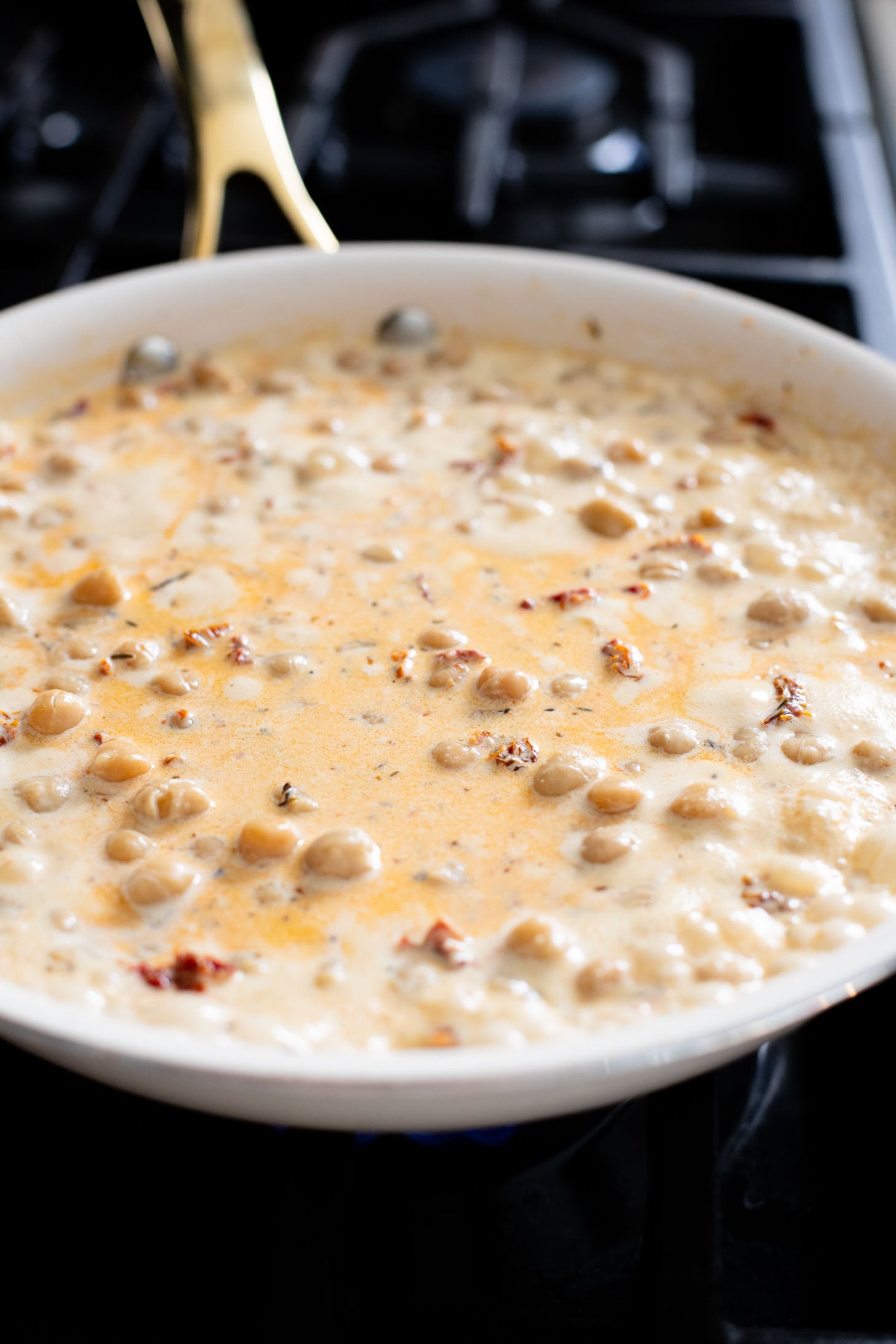 These Marry Me Chickpeas are creamy, delicious...and made in one pot! The perfect Tuscan flavor and best served with toasted bread | ThisSavoryVegan.com