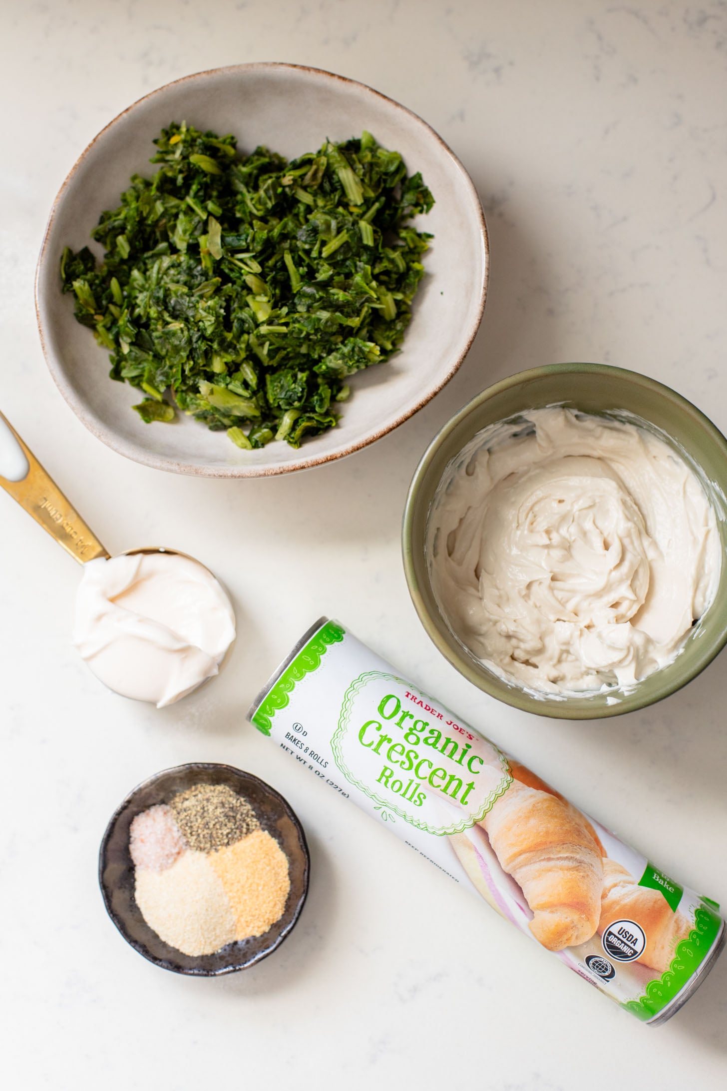 These Spinach Dip Crescent Bites are the perfect vegan holiday appetizer! Bite-sized and dairy-free, these are easy & tasty | ThisSavoryVegan.com