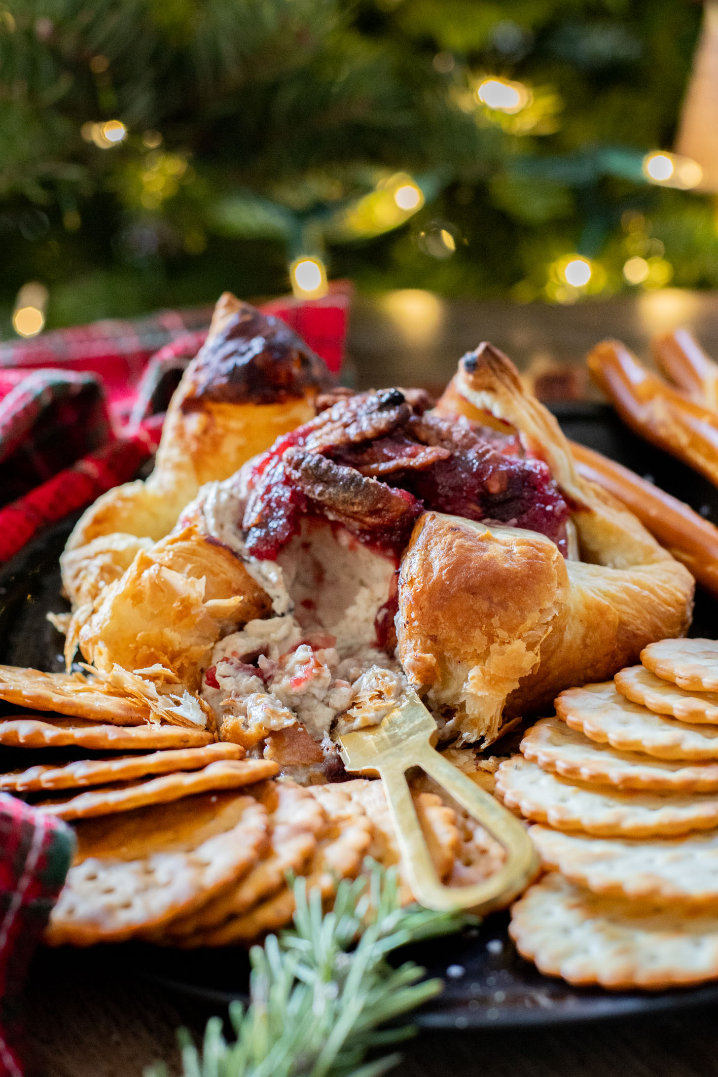 This Vegan Cranberry Baked Brie is a holiday must make! Vegan brie is topped with cranberry sauce & baked in puff pastry for the best vegan appetizer | ThisSavoryVegan.com