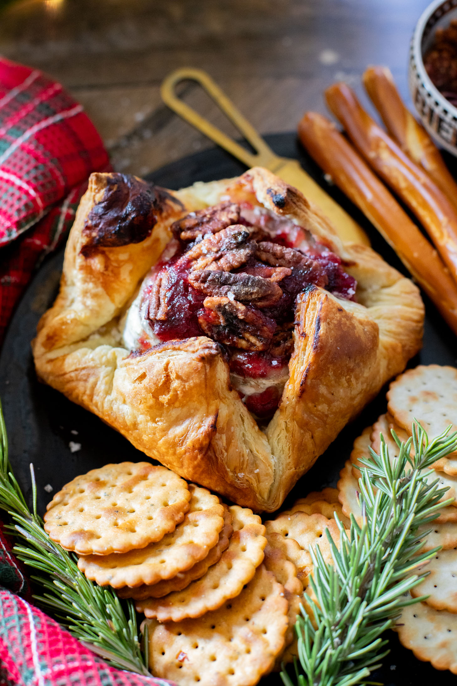 This Vegan Cranberry Baked Brie is a holiday must make! Vegan brie is topped with cranberry sauce & baked in puff pastry for the best vegan appetizer | ThisSavoryVegan.com
