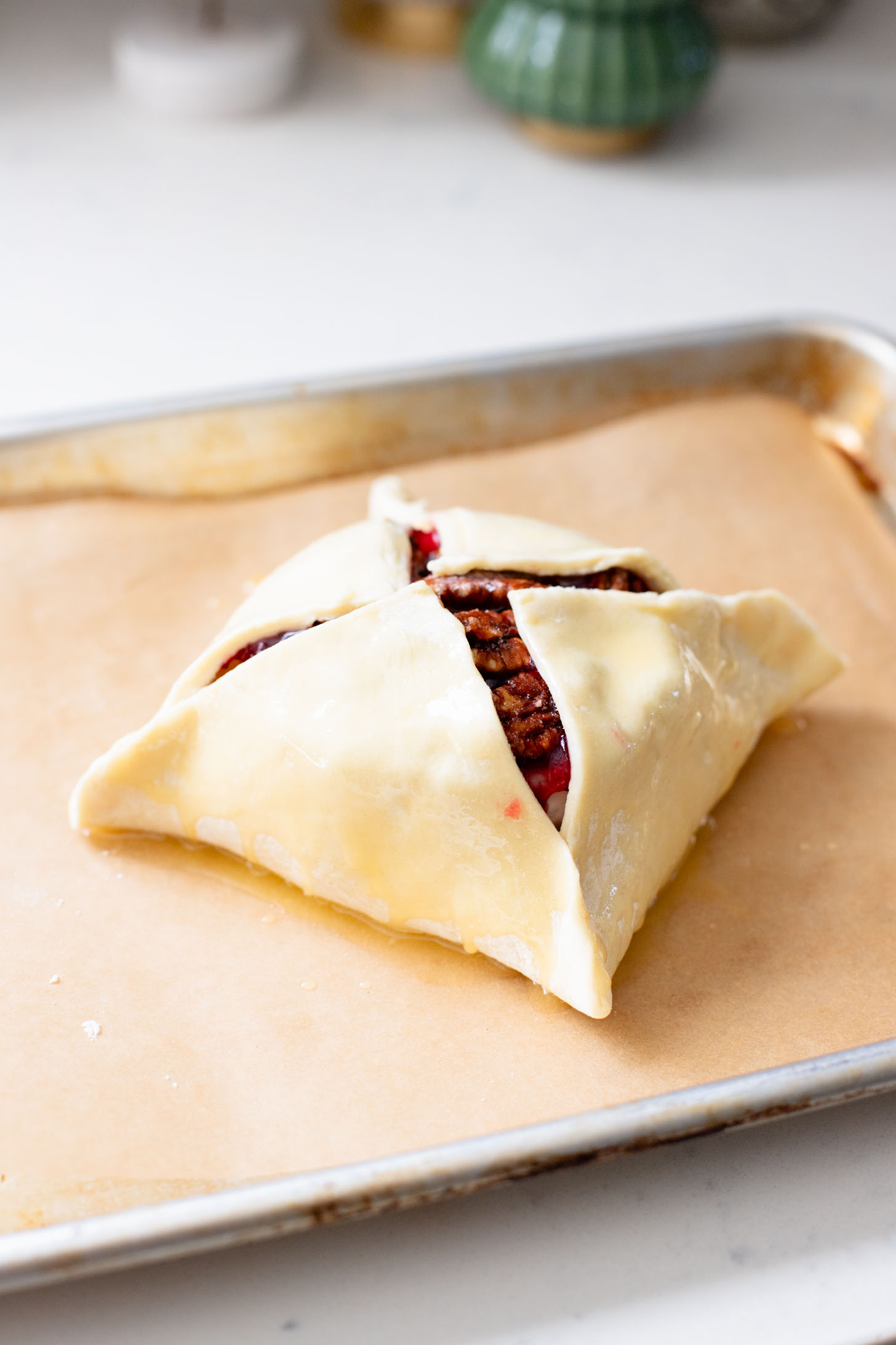 This Vegan Cranberry Baked Brie is a holiday must make! Vegan brie is topped with cranberry sauce & baked in puff pastry for the best vegan appetizer | ThisSavoryVegan.com