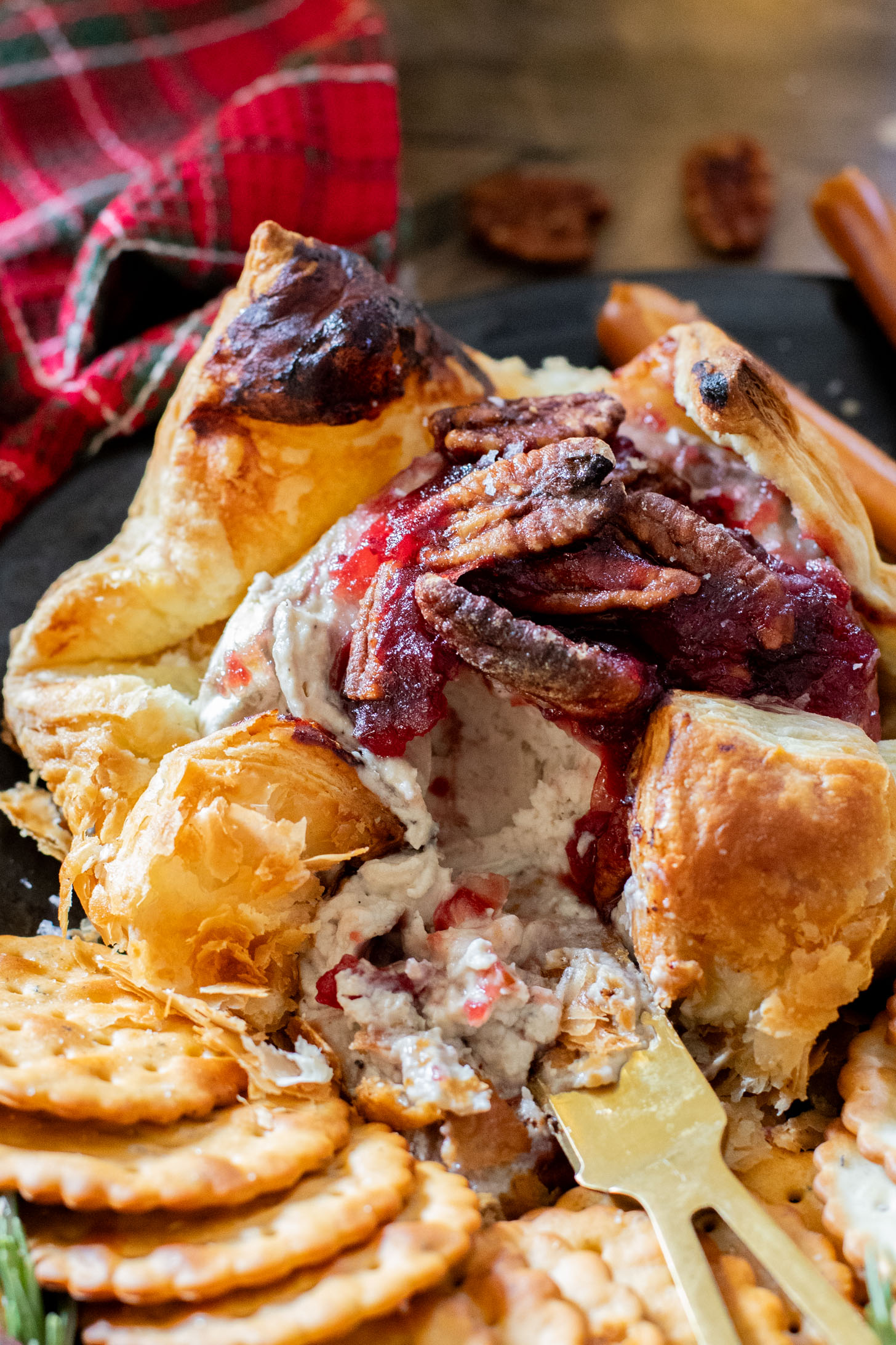 This Vegan Cranberry Baked Brie is a holiday must make! Vegan brie is topped with cranberry sauce & baked in puff pastry for the best vegan appetizer | ThisSavoryVegan.com