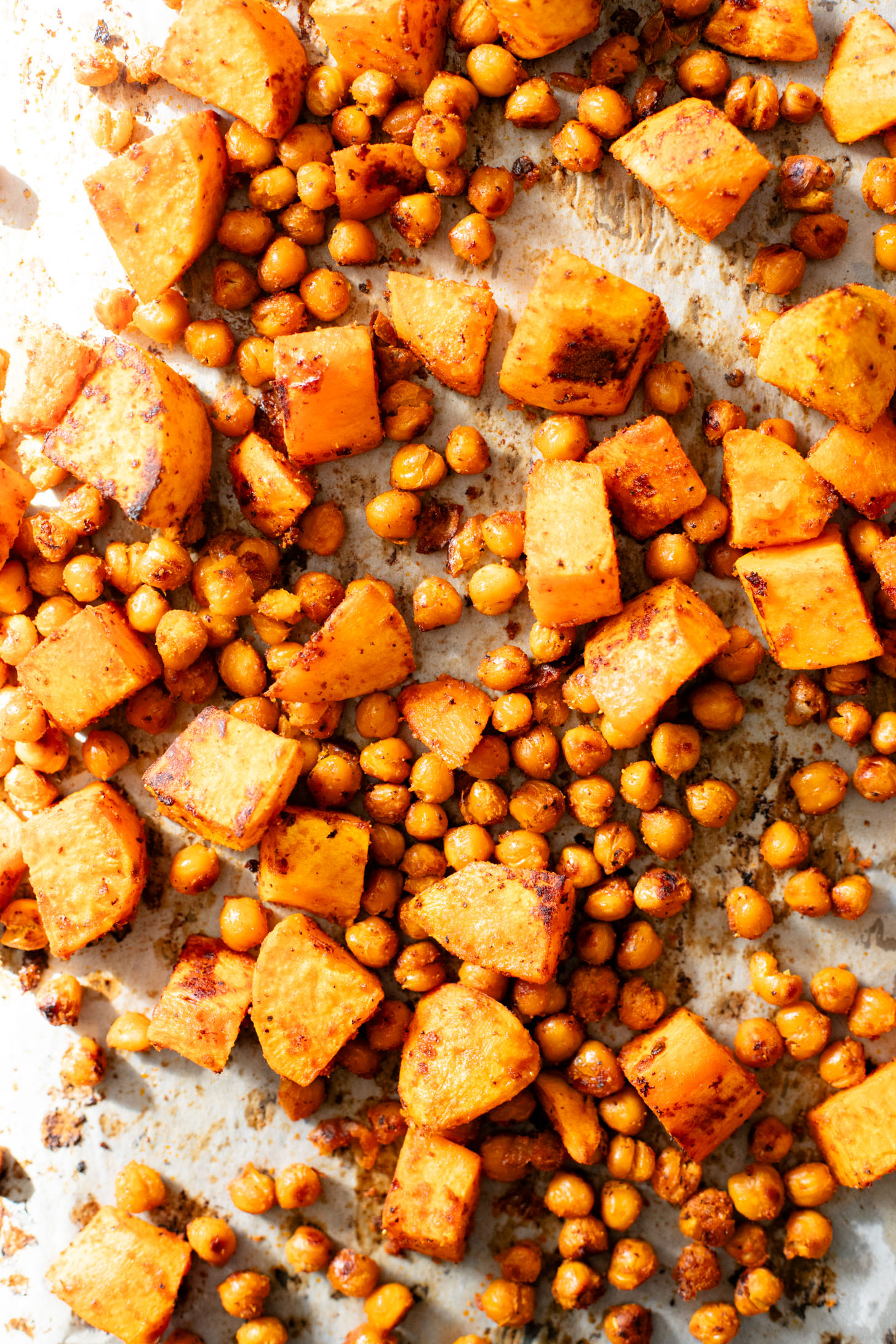 These Chipotle Sweet Potatoes & Chickpeas are made on one sheet pan and served over rice with the BEST cilantro dressing | ThisSavoryVegan.com