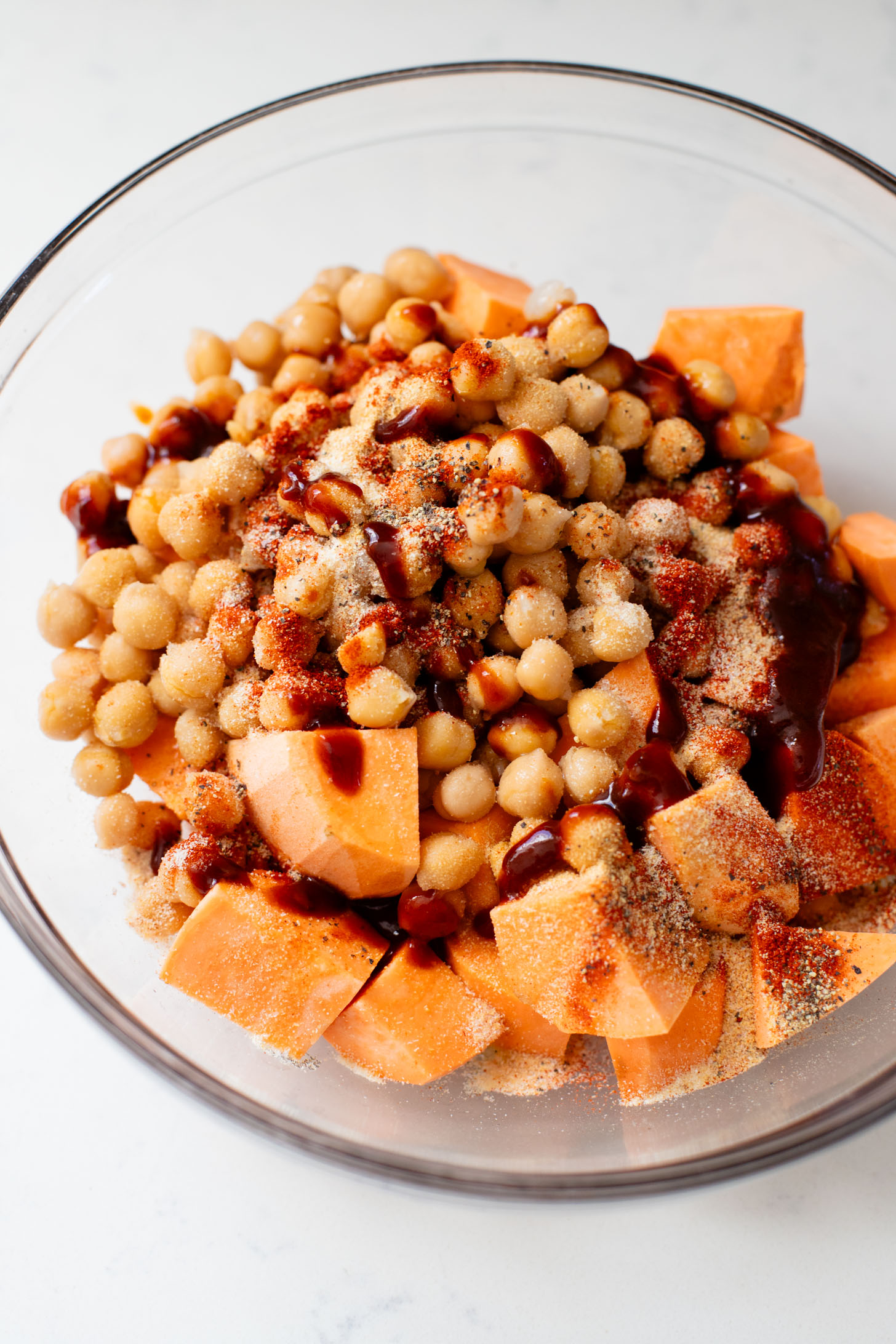 These Chipotle Sweet Potatoes & Chickpeas are made on one sheet pan and served over rice with the BEST cilantro dressing | ThisSavoryVegan.com