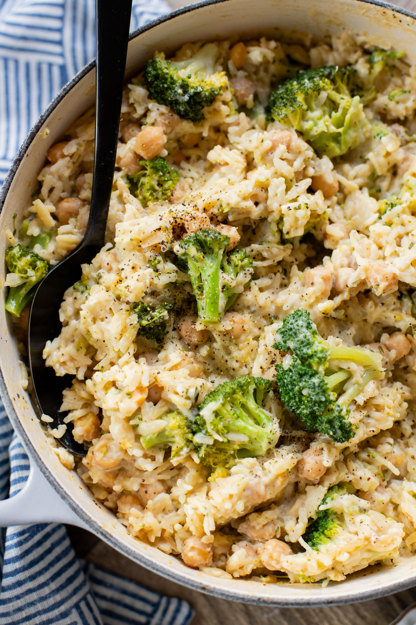 This Creamy Broccoli & Rice is a one-pot vegan dinner that is filled with chickpeas, rice, broccoli and a creamy non-dairy sauce | ThisSavoryVegan.com
