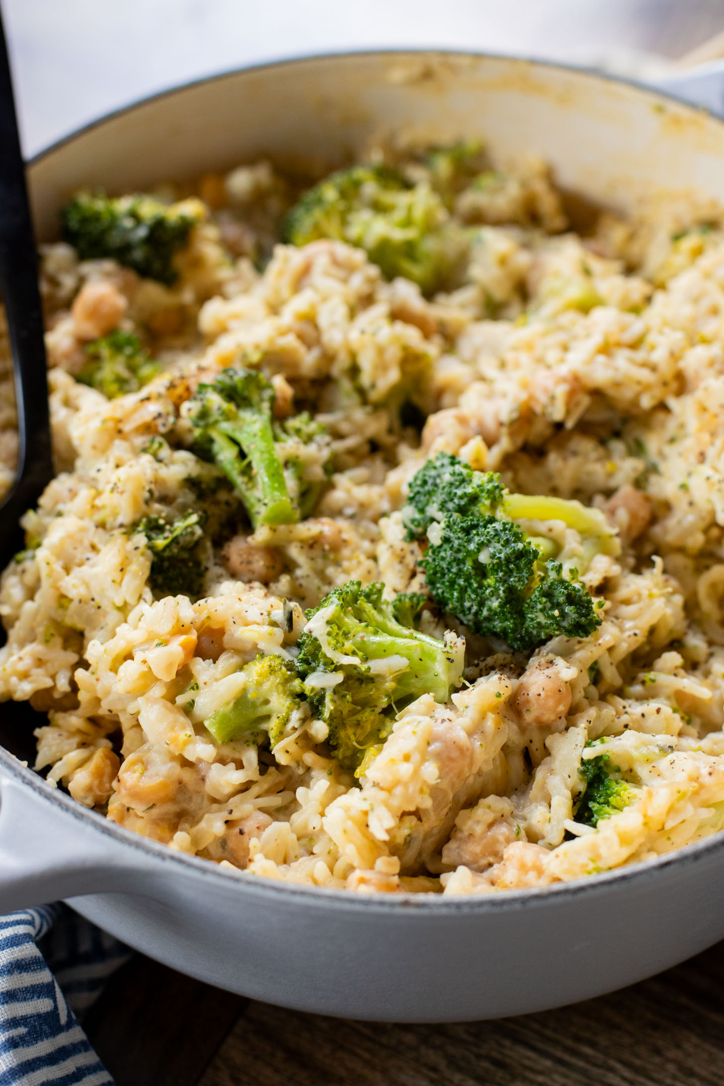 This Creamy Broccoli & Rice is a one-pot vegan dinner that is filled with chickpeas, rice, broccoli and a creamy non-dairy sauce | ThisSavoryVegan.com
