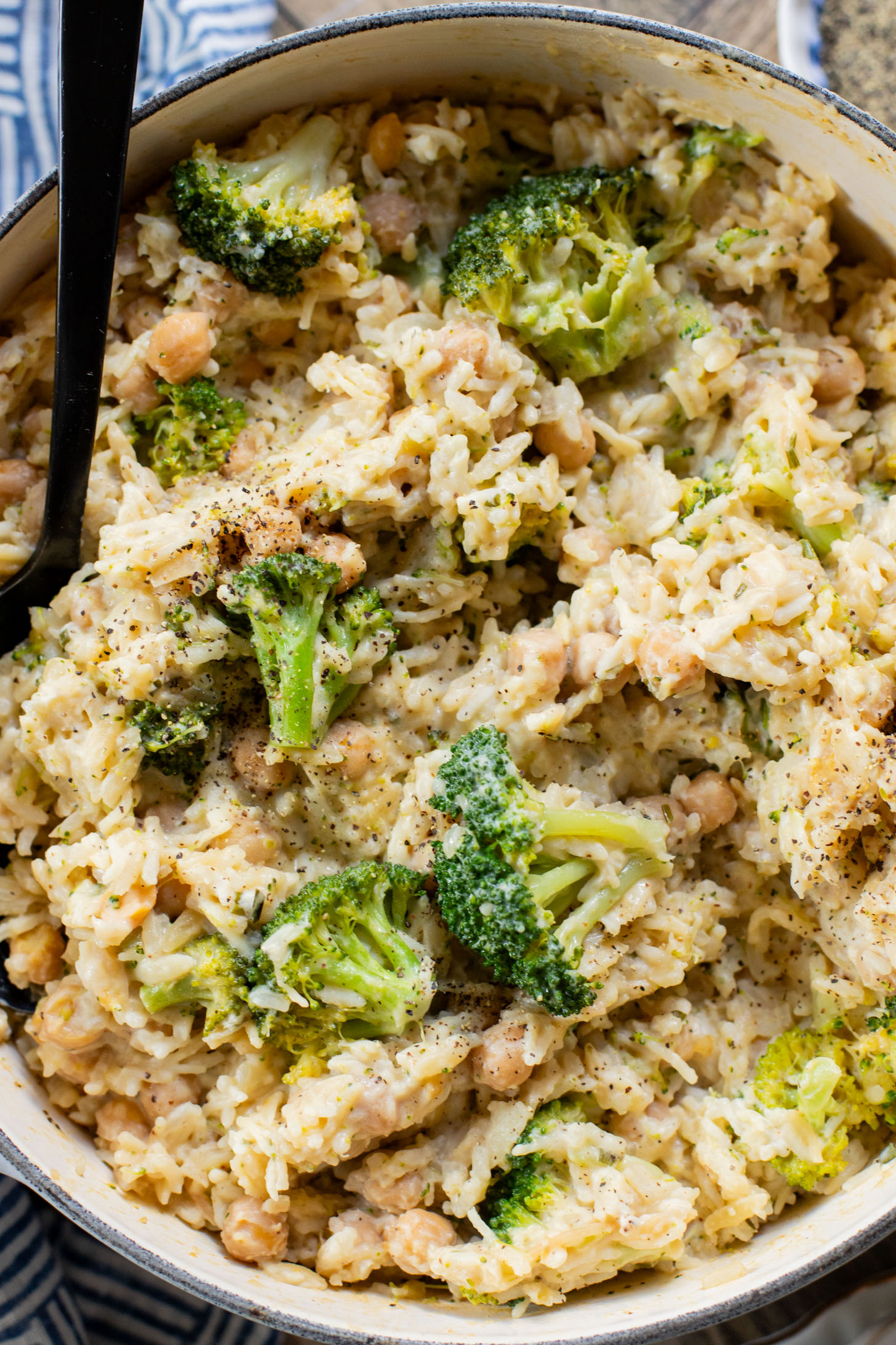 This Creamy Broccoli & Rice is a one-pot vegan dinner that is filled with chickpeas, rice, broccoli and a creamy non-dairy sauce | ThisSavoryVegan.com