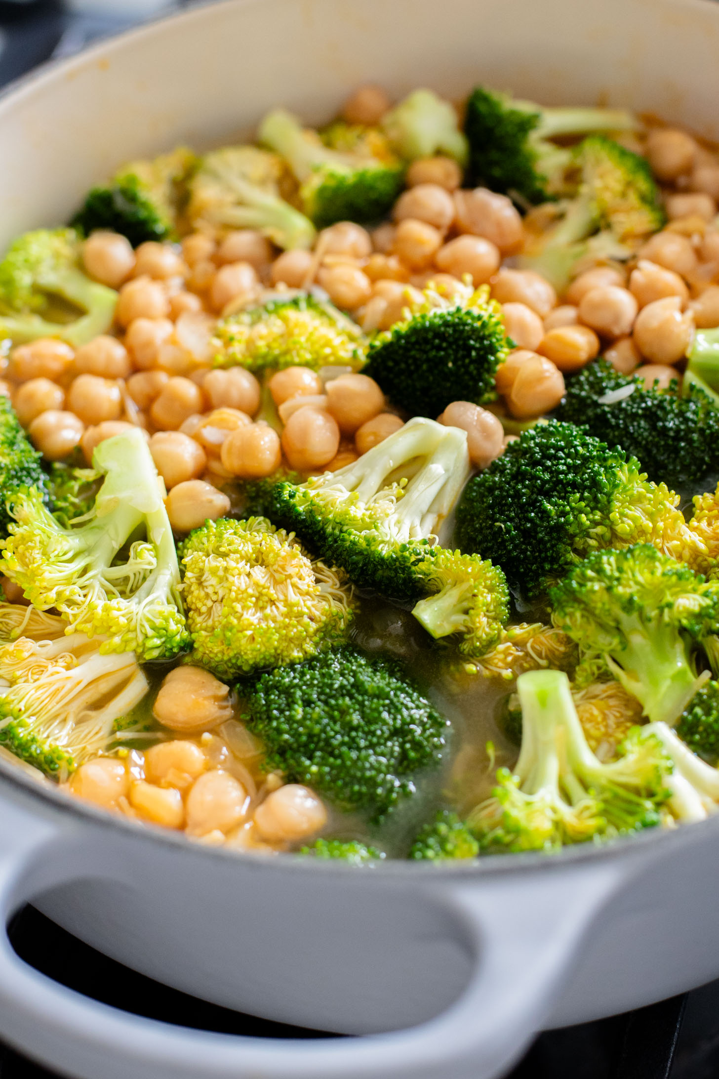 This Creamy Broccoli & Rice is a one-pot vegan dinner that is filled with chickpeas, rice, broccoli and a creamy non-dairy sauce | ThisSavoryVegan.com