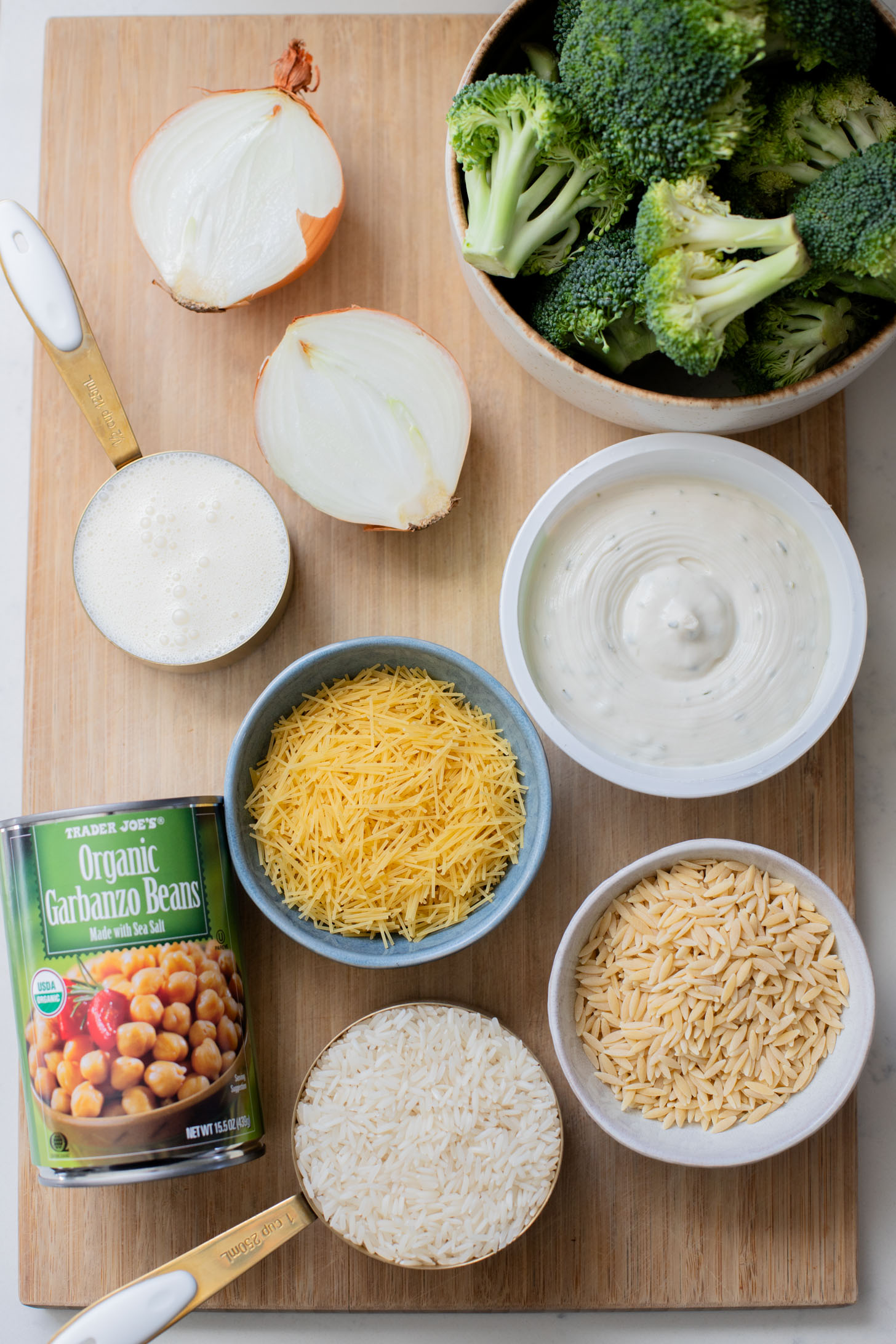This Creamy Broccoli & Rice is a one-pot vegan dinner that is filled with chickpeas, rice, broccoli and a creamy non-dairy sauce | ThisSavoryVegan.com