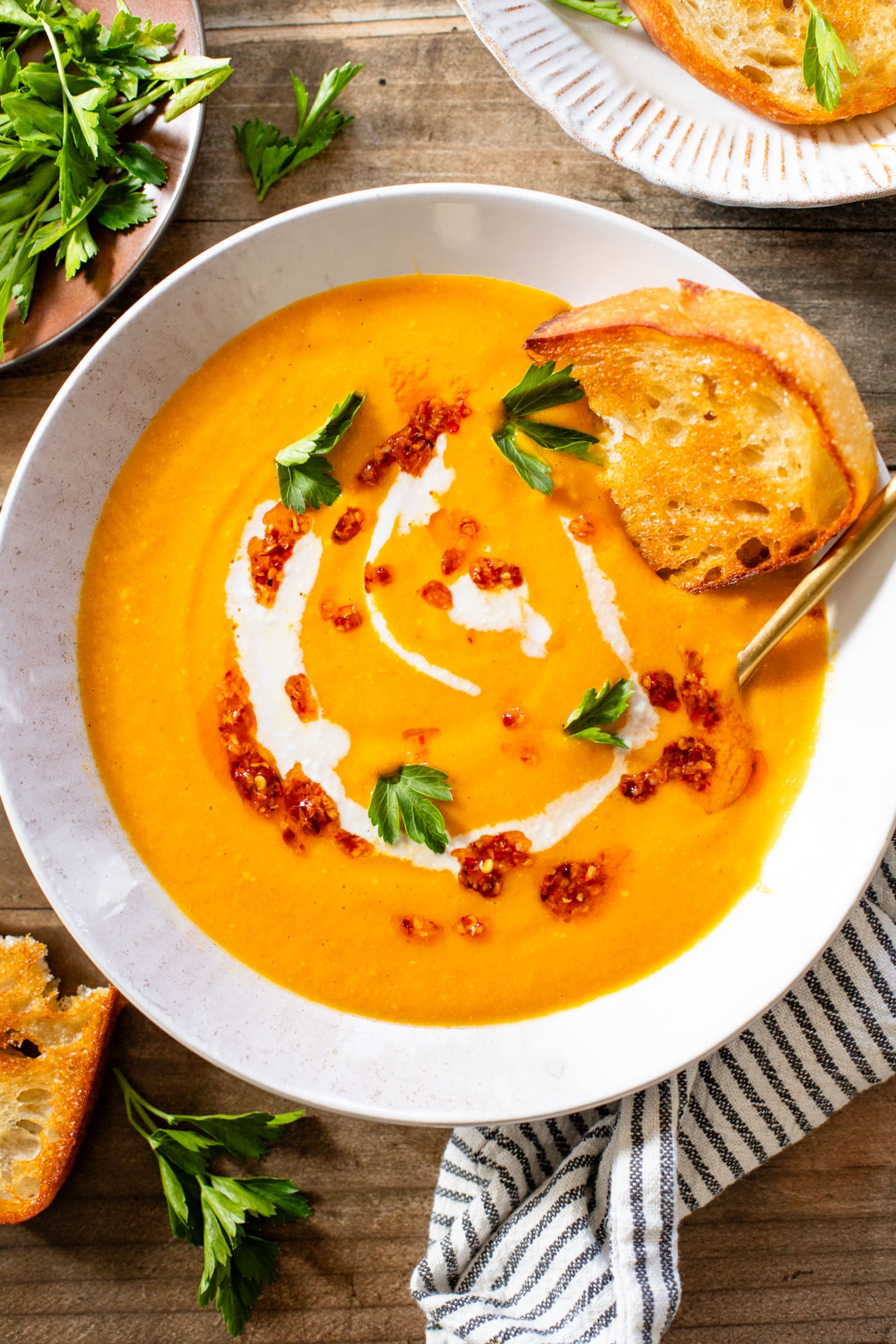 This Creamy Roasted Carrot Soup is dairy-free and packed with veggies. A super simple vegan soup recipe that packs lots of flavor | ThisSavoryVegan.com