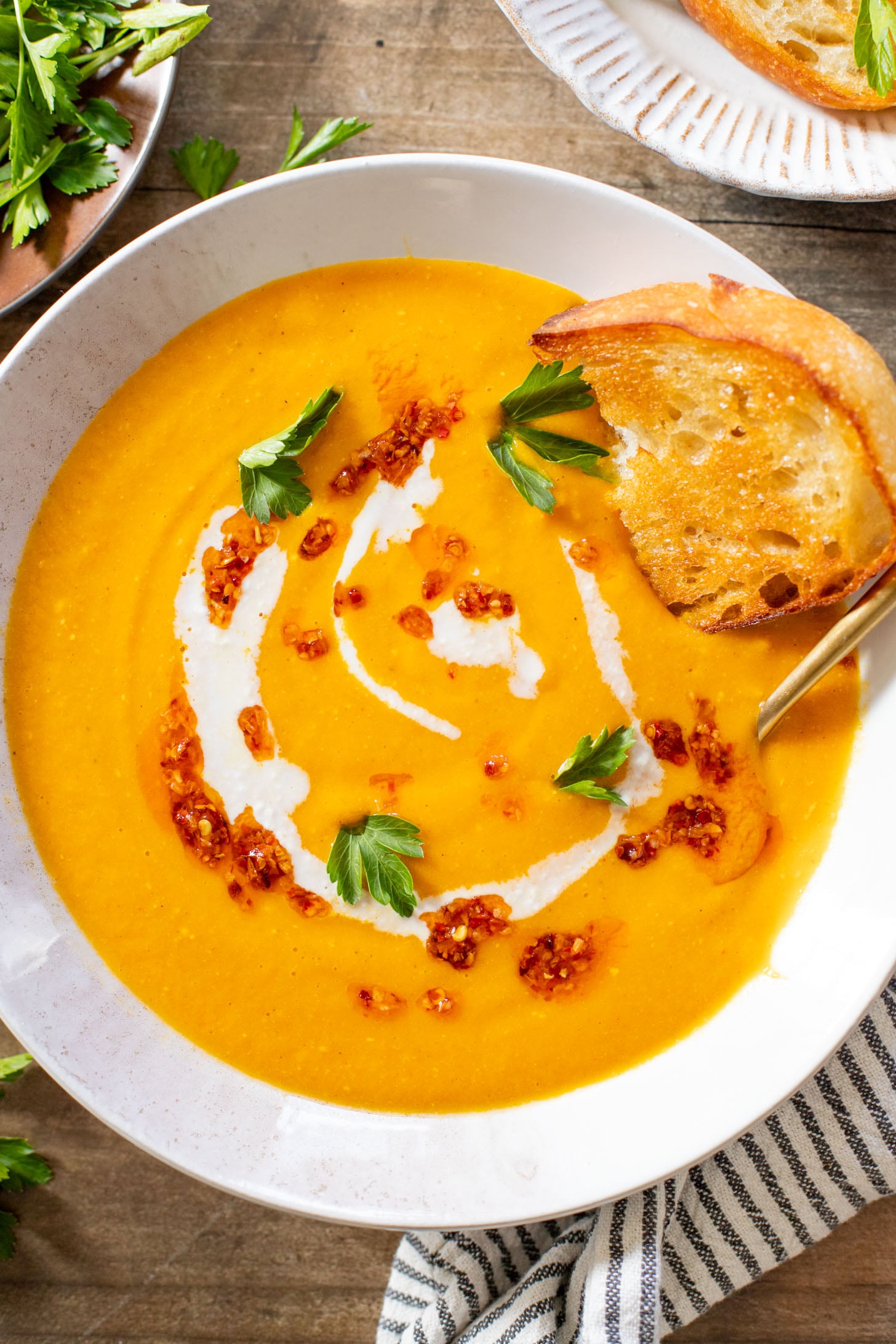This Creamy Roasted Carrot Soup is dairy-free and packed with veggies. A super simple vegan soup recipe that packs lots of flavor | ThisSavoryVegan.com