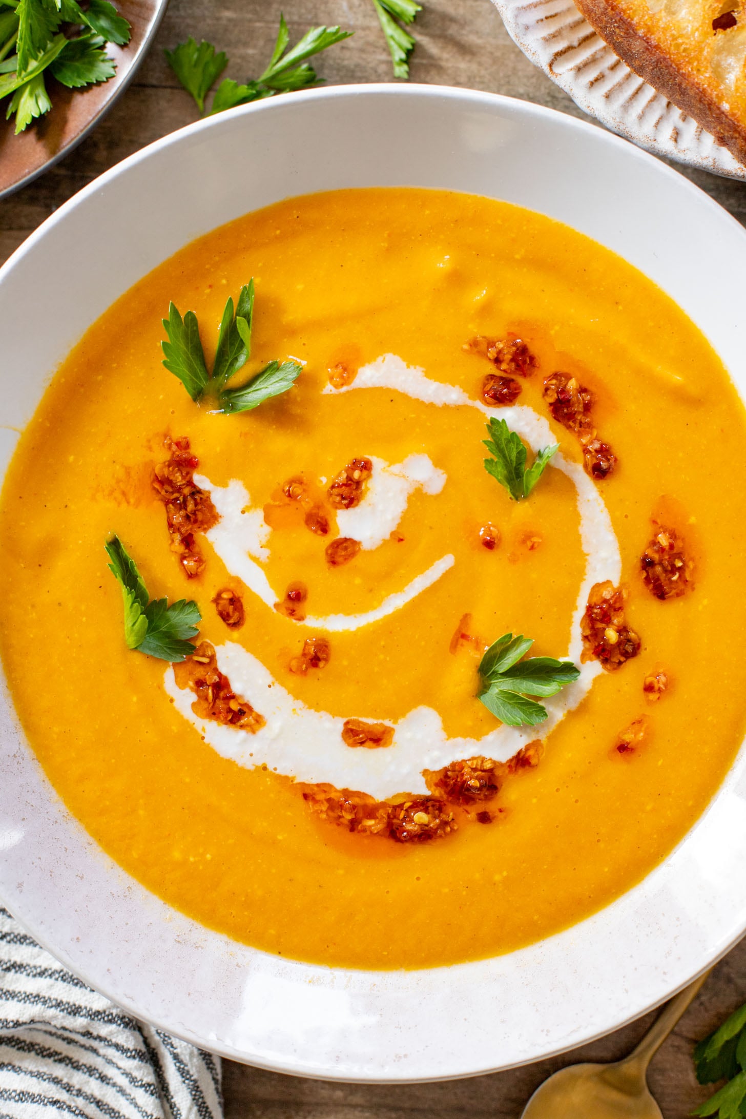 This Creamy Roasted Carrot Soup is dairy-free and packed with veggies. A super simple vegan soup recipe that packs lots of flavor | ThisSavoryVegan.com