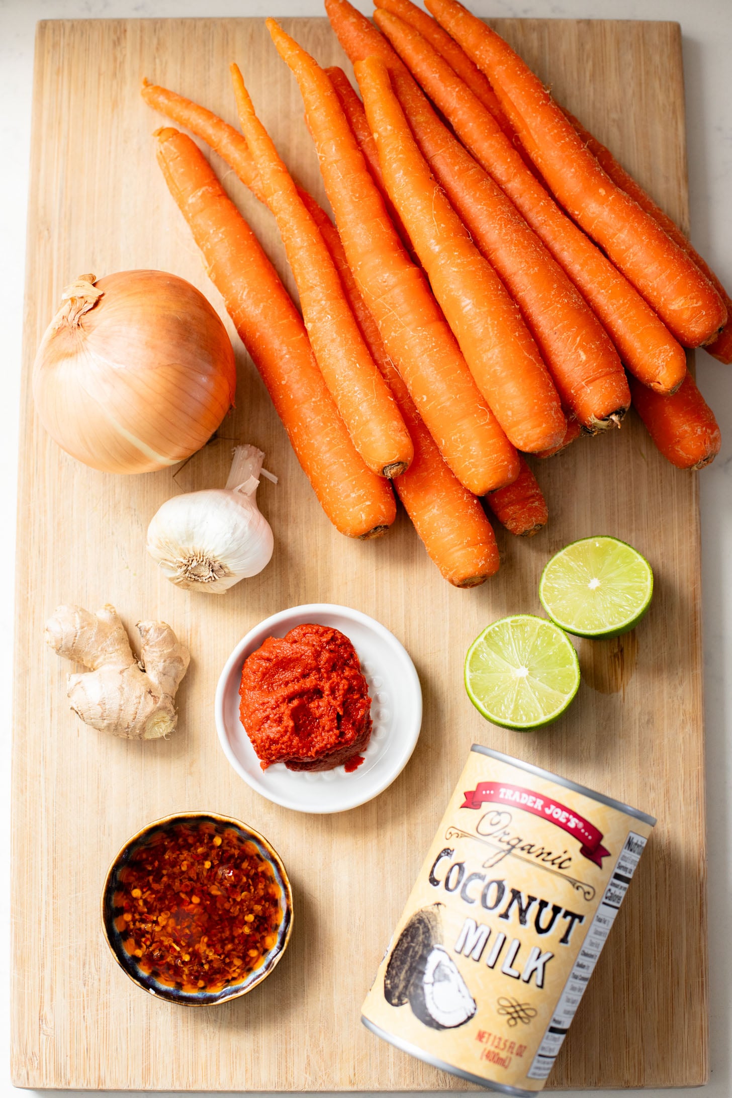 This Creamy Roasted Carrot Soup is dairy-free and packed with veggies. A super simple vegan soup recipe that packs lots of flavor | ThisSavoryVegan.com